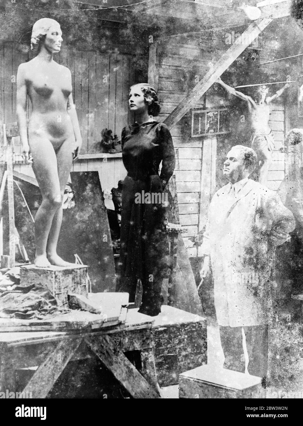 Margaret Leaver sculptor observes a sculpture of a woman . 1935 Stock Photo