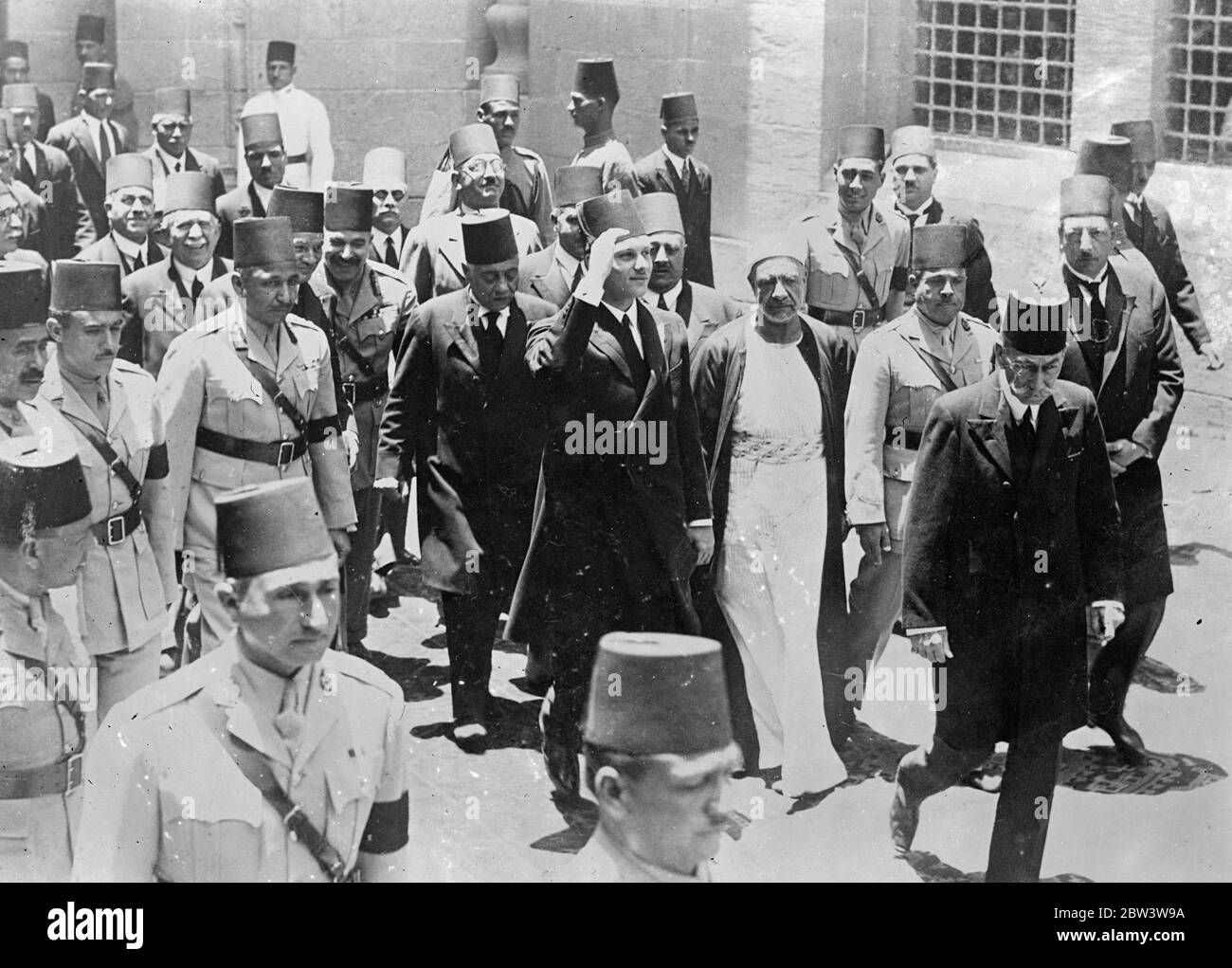 King Farouk Pays Official Visit To His Father ' s Tomb The 16 - year - old King Farouk of Egypt , accompanied by members of the Court , paid offcial visit to the tomb of his father , King Fuad , who died while the young King was studying in England . Crowds cheered the boy King as he drove through the streets of Cairo to the Rifai Mosque . Photo shows : King Farouk saluting as he arrived at the Rifai Mosque [ Al - Rifa ' i , Al - Refai , Al - Refa ' i Mosque ,  Royal Mosque  ] 2 June 1936 Stock Photo