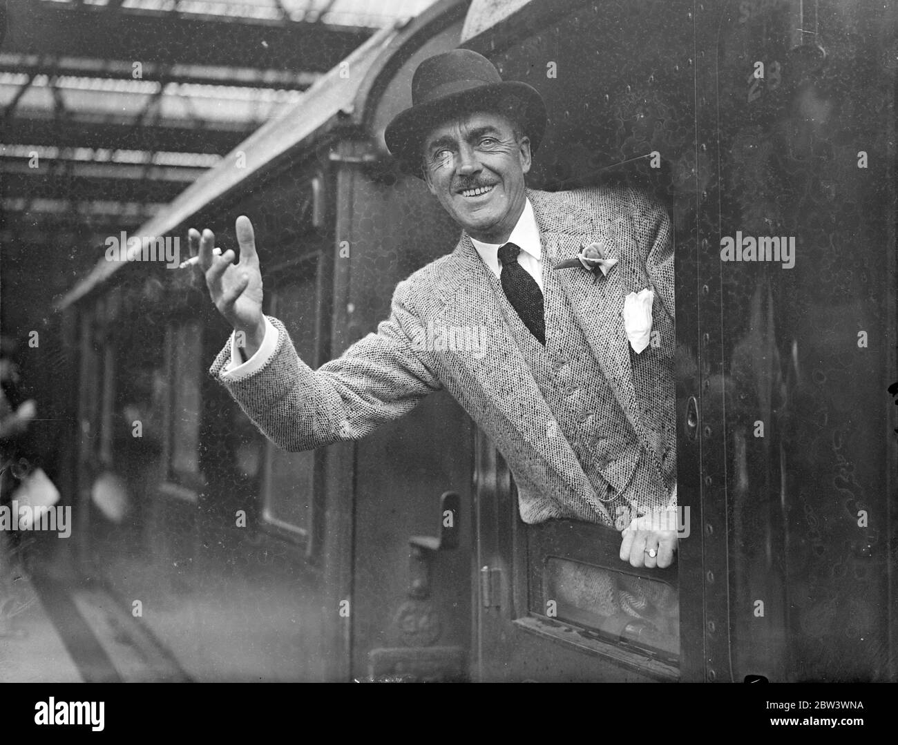 PLA Official Leaves For South Africa To Boost Trade With London . Mr . A . E . Wildey , Public Relations Officer of the Port of London Authority , left Waterloo Station on the  Stirling Castle  boat train for South Africa where he is undertaking a mission to foster trade between London and South Africa . Photo shows : Mr . A . E . Wildey in his carriage window at Waterloo . 21 Aug 1936 Stock Photo