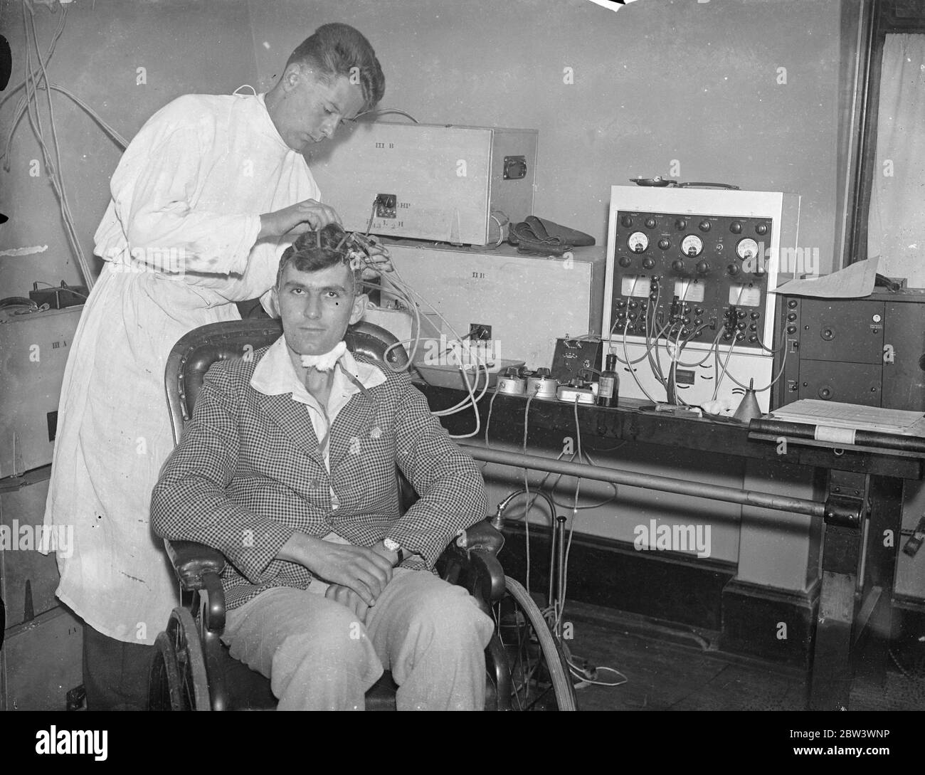 London Scientist Measures Brain Waves . Mr . William Grey Walter , a young Cambridge scientist at the Maida Vale Hospital , London , has devised an apparatus for measuring brain waves . He uses an ordinary radio set as an amplifier and records on an electrical amplifier and records on an electrical measuring apparatus the intensity of the brain waves . Metal plates are placed at chosen spots on the subject ' s skull and connected with the instrument . The experiment prooves that the thought process in human brain produces electrical emanations powerful enough to be visibly recorded . Normal th Stock Photo