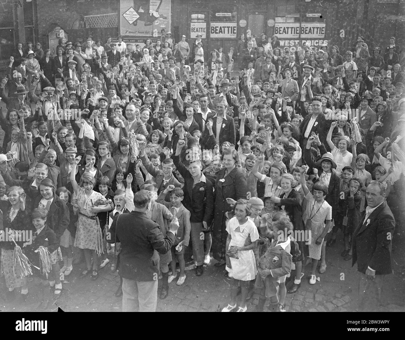 Three Hundred London Children Taken On A Busmen ' s Holiday Three hundred children left Hendon by train for a day at Southend with men of the Hendon London Transport garage as their hosts . Photo shows : The children cheering at the Hendon IMS Station as they left . 17 Aug 1936 Stock Photo