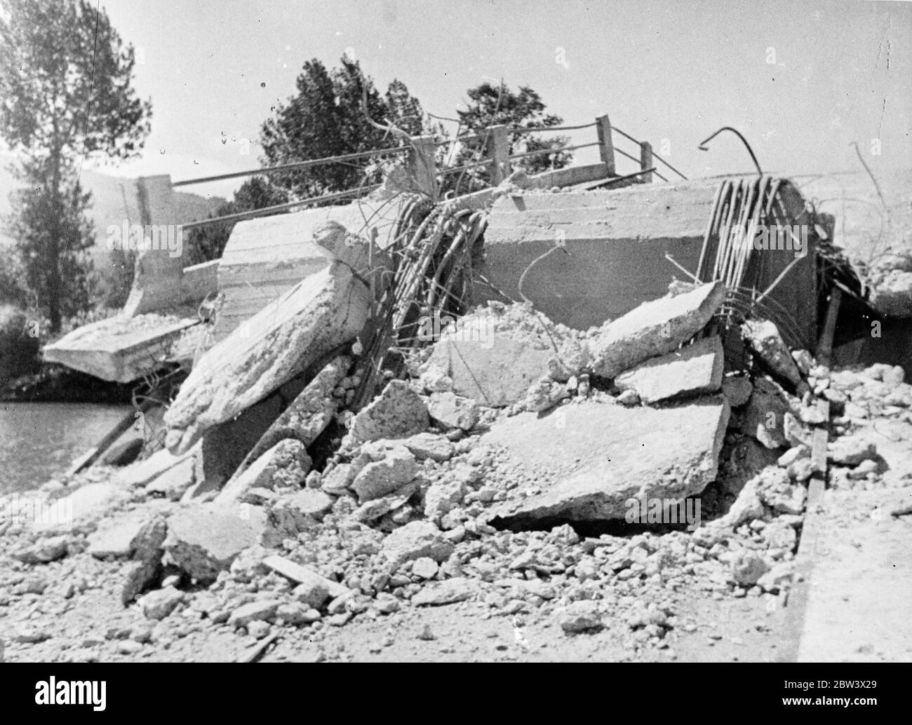 Loyalists Blow Up A Bridge Near Saragossa . A bridge over a river near Zaragoza the city held by the rebels , was dynamited by Government forces , who are carrying on guerrilla warfare in this district . Photo shows : the bridge completely wrecked by the explosion . 26 Aug 1936 Original caption from negative Stock Photo