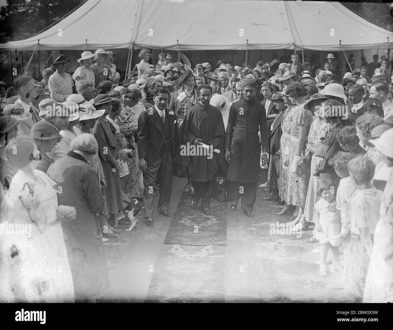 Emperor Haile Selassie of Ethiopia and members of his family and suite visited the Woking Mosque ( Surrey ) from Bath . The Moslem community gave an address of welcome , and Indian potentates were present . Photo shows : Emperor Haile Selassie leaving the Mosque after his visit . 25 Aug 1936 Original caption from negative The Shah Jahan Mosque was the first purpose built mosque in Europe outside of Muslim Spain Stock Photo