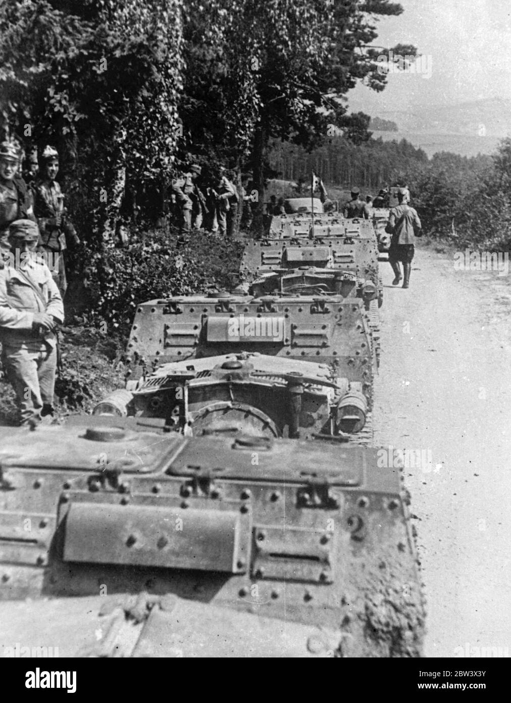 Austria ' s  Rapid Division  On Manoeuvre The mechanised  Rapid Division  of the Austrian Army is undergoing manoeuvres under the direction of General Kubena Photo shows : Light tanks lined up on a country road . 24 August 1936 Original caption from negative Stock Photo