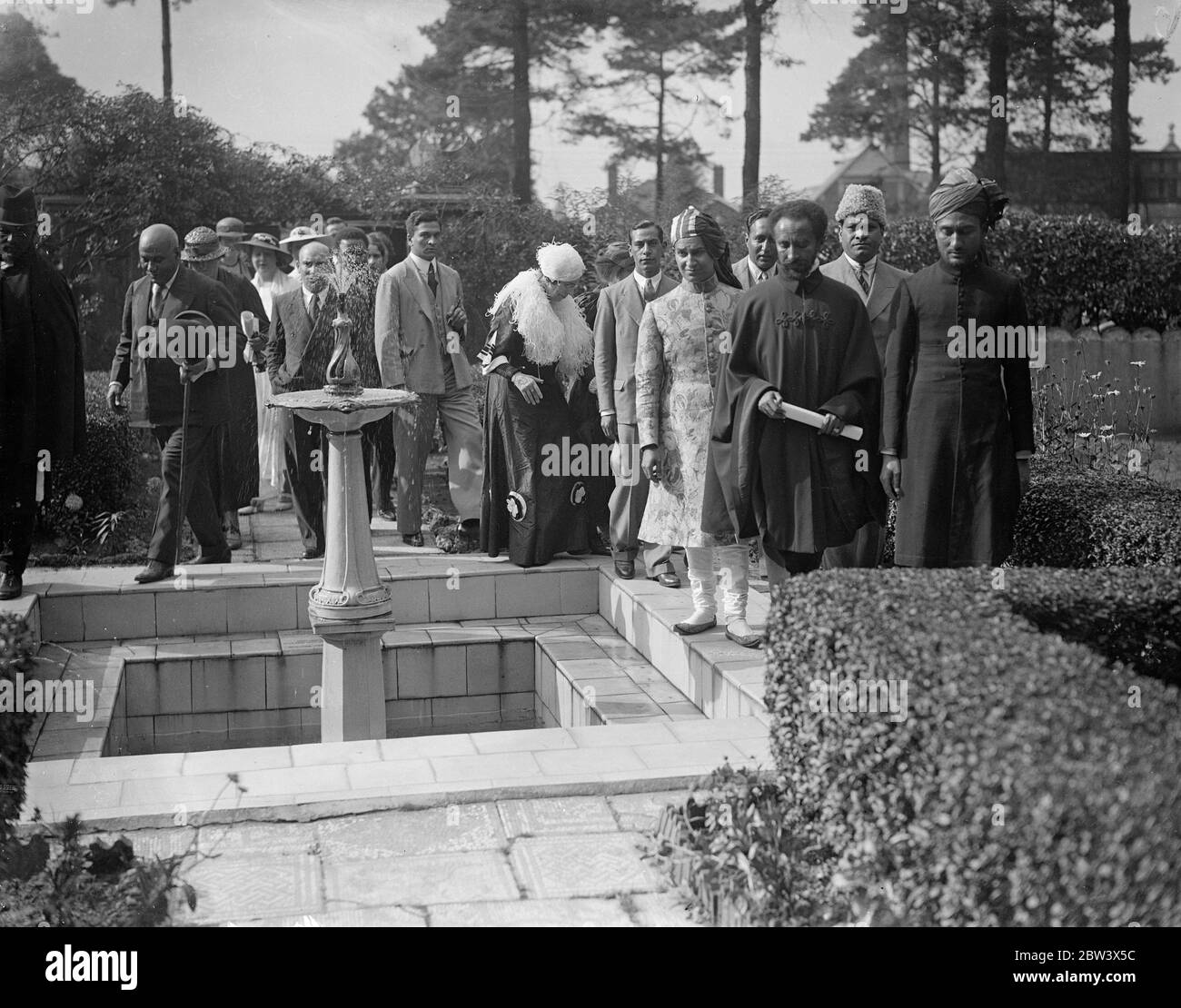 Emperor Haile Selassie At Woking Mosque . Emperor Haile Selassie of Ethiopia and members of his family and suite visited the Woking Mosque ( Surrey ) from Bath . The Moslem community gave an address of welcome , and Indian potentates were present . Photo shows : Emperor Haile Selassie at the Mosque . 25 Aug 1936 Original caption from negative The Shah Jahan Mosque was the first purpose built mosque in Europe outside of Muslim Spain Stock Photo
