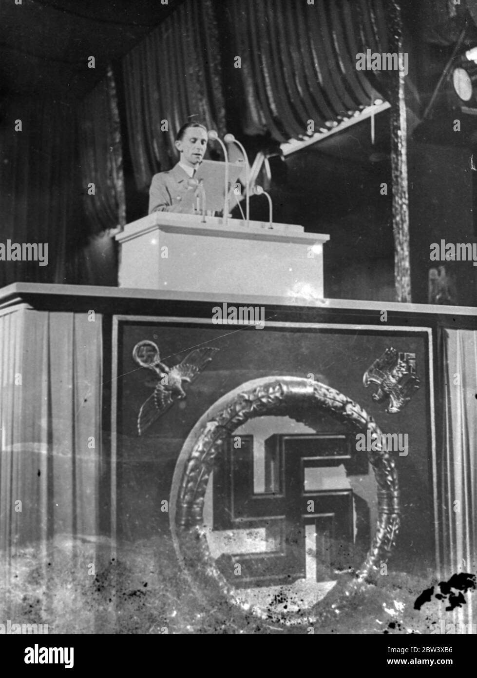 Dr . Goebbels makes violent attacks on Bolshevism at Nazi Congress . A violent attack on Bolshevism and the Jews was launched by Dr . Joseph Goebbels German Minister of propaganda, when he spoke at the Nazi party congress in Nuremberg .  [ He ? ] would ward off any attempt by Moscow to make Bolshevist propaganda in Germany with methods the ruthlessness of which would even surprise Moscow  , he declared .  Bolshevism is a pathological , criminal madness carried out by Jews as a means of an insulating the civilised nations of Europe  . Dr . Goebbels asserted . Photo shows : Dr Goebbels speaking Stock Photo