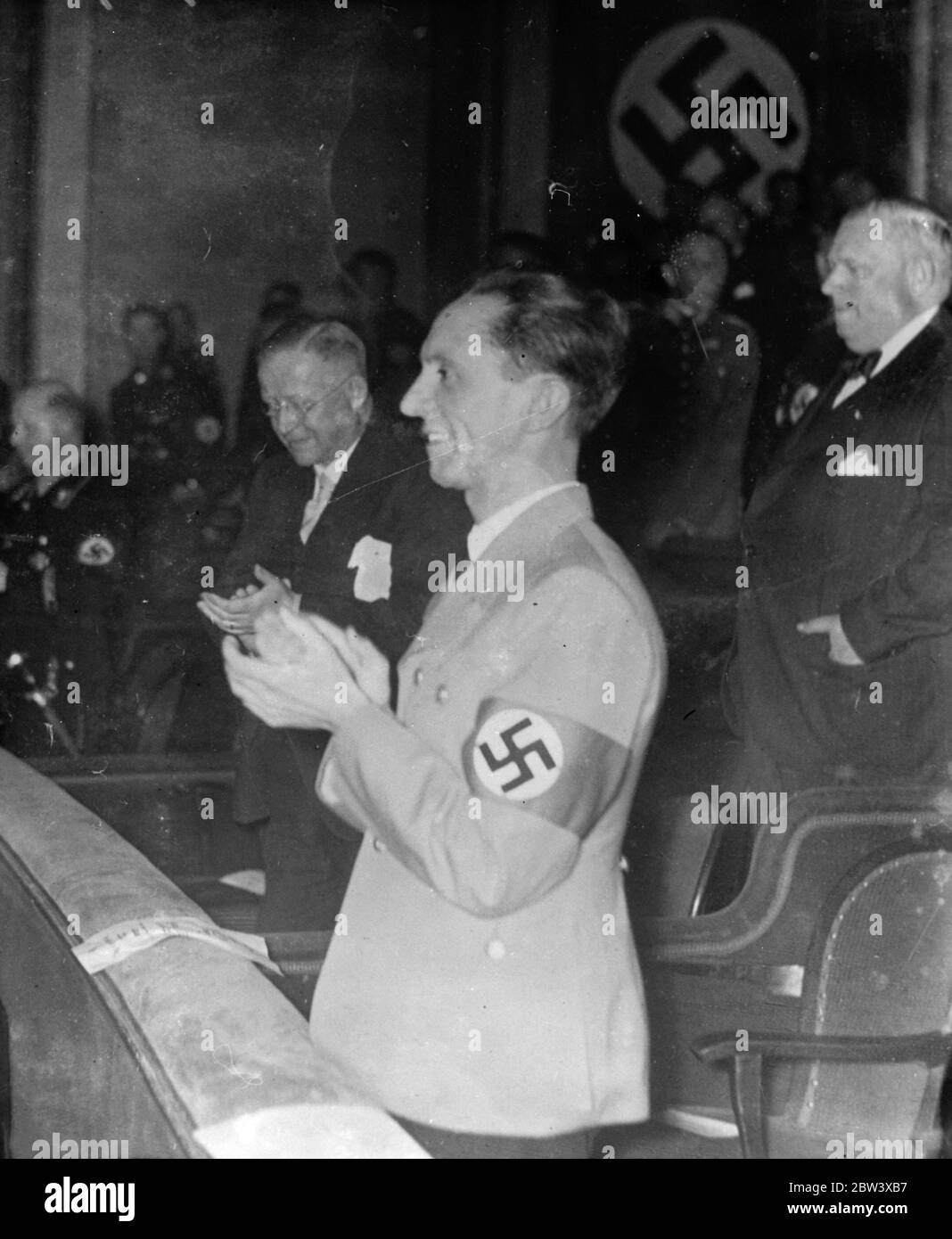 Gr Goebbels applauds ' Traitor ' . Dr Josef Goebbels , German Minister of Propaganda , whose new attack on Bolshevism and the Jews at the Nazi Congress has startled the world , smiles and applauds at the premiere of the ew German film ' Traitor ' which took place at Nuremberg in connection with the Congress . 11 September 1936 Stock Photo