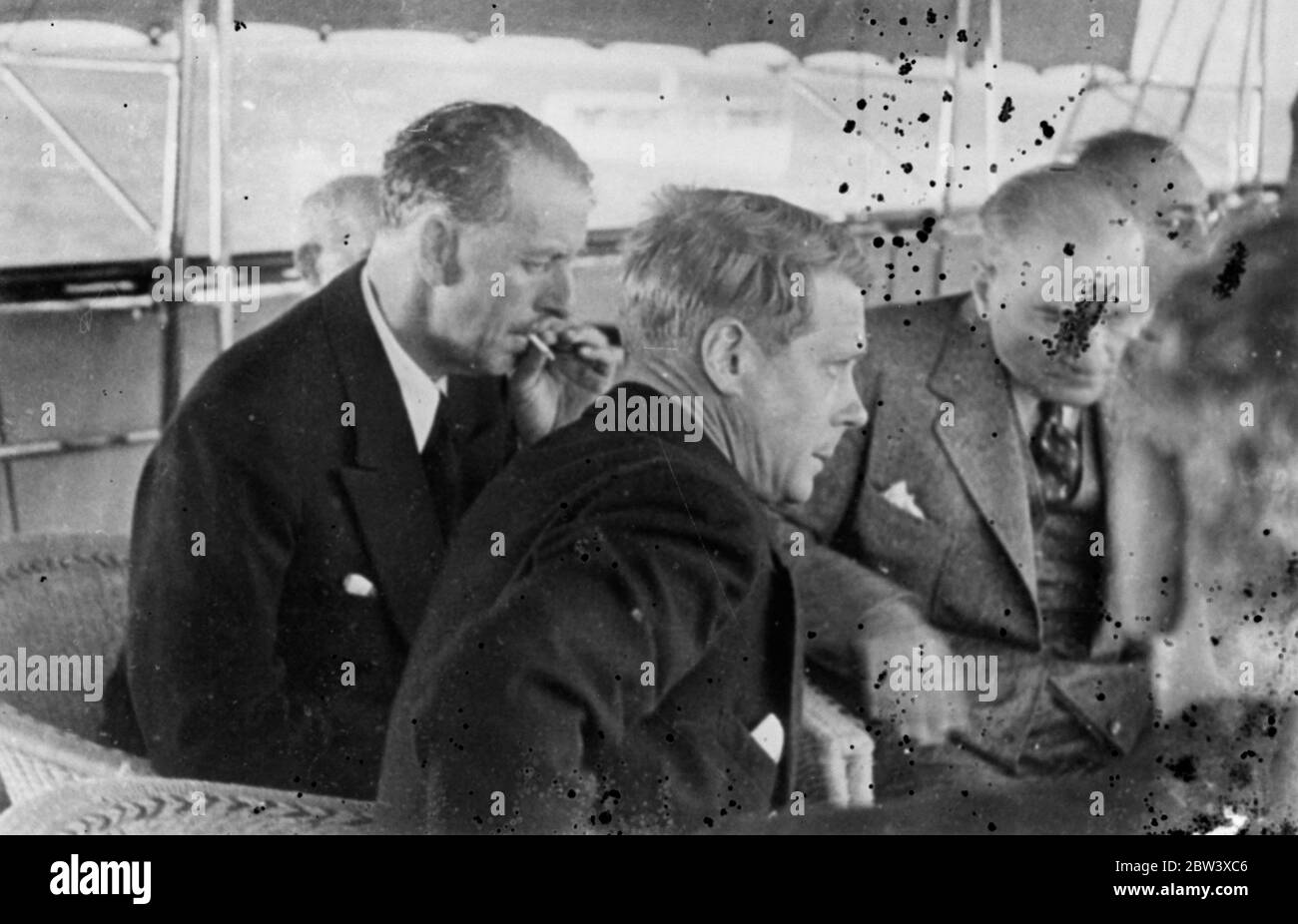 The King ' s intimate talk with Ataturk . New Picture . These pictures , just received in London , show the intimacy with which King Edward VIII chatted with Kemal Ataturk , the Turkish Dictator , when the King watched from the President ' s yacht , Ertogrul a special regatta held in his honour just before he left Istanbul . The King joined the President in drinking Turkish coffee . Photo shows , King Edward and Kemal Ataturk ( lighter suit ) in more serious mood aboard the Ertogrul . 11 September 1936 Stock Photo