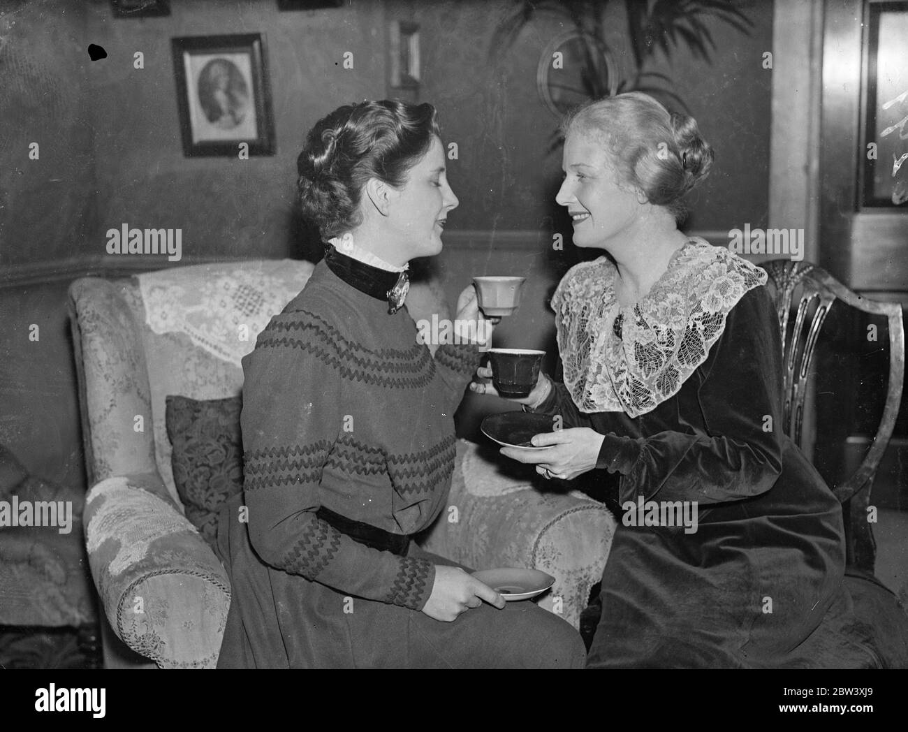 The two candidas Ann Harding wishes successor good luck in Shaw Play. In the costume she wore for the part, Miss Ann Harding wishes good luck to hear successor, Miss Diana Wynyard, who is taking over the role of Candida in Bernard Shaw's play of that name at the Globe Theatre, Shaftesbury Avenue, London. Photo shows: Miss Ann Harding wishes her successor, Miss Diana Wynyard, good luck at the Globe Theatre. Both are wearing Candida's costume. 30 March 1937 Stock Photo