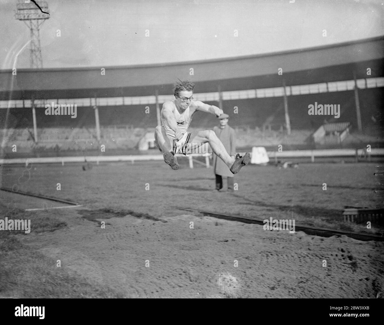 Oxford long jumper practises at White City Oxford University athletes practised at the White City , London , for the Inter Varsity sports meeting with Cambridge to take place at the White City on March 20 . Photo shows , R R Ferguson University of South California and Lincoln ( Oxford ) practising for the pole vault . 12 March 1937 Stock Photo