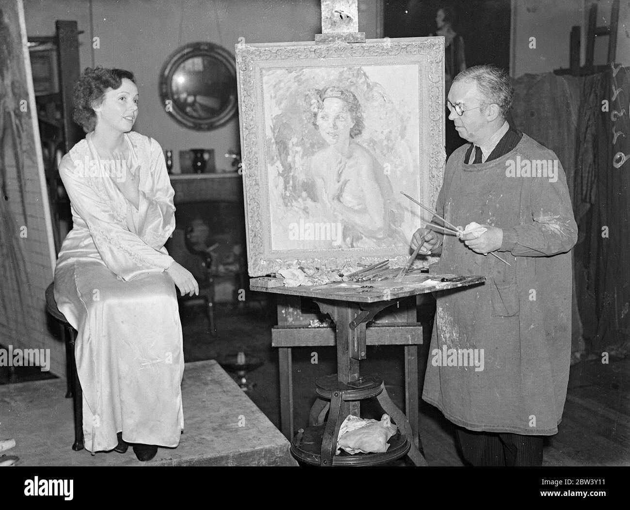 Jessie Matthew ' s portrait for Royal Academy . A portrait of Miss Jessie Matthews , the stage and film actress is being painted by Mr T C Dugdale , ARA , at his London studios , for entry in this year ' s Royal Academy . The actress is pictured against a woodland background . Photo shows , Miss Jessie Matthews sitting for her portrait on which Mr TC Dugdale is working at his London studios . 10 March 1937 Stock Photo