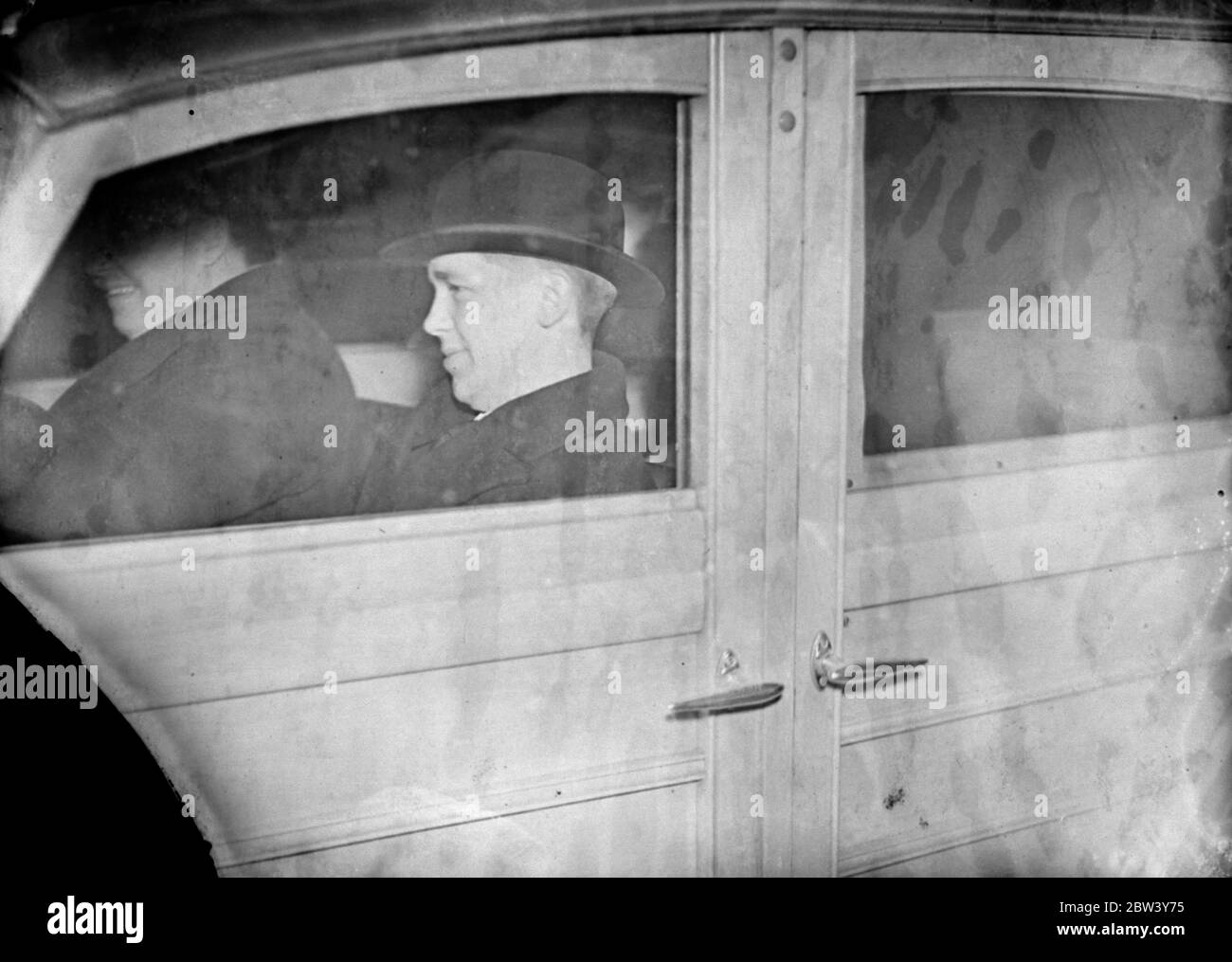 Duke of Windsor ' s new chauffer in London on way to Vienna . 22 year old sportsman . Appointed as chauffeur to the Duke of Windsor , 22 year old Tom Webster , who was employed at a Melton ( Leicestershire ) garage , arrived in London on his way to Vienna to join the Duke ' s staff . The Duke of Windsor frequently used Webster ' s garage when hunting at Melton Mowbray . Mr Webster is well known in the county as a cricketer and footballer . Photo shows , Mr Tom Webster leaving St Pancras Station by car . 8 March 1937 Stock Photo