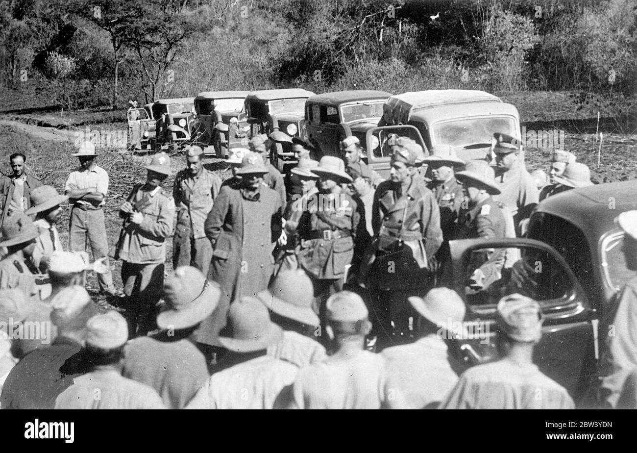Viceroy of Abyssinia on ' peace ' mission . Expedition in search of grievances . The Viceroy of Abyssinia , General Graziani , and high officials of the Italian administration are touring areas of the Abyssinian provinces for the purpose of the inspecting the work of colonialisation and setting local grievances . It is hoped by this means to facilitate pacification of Italy new colony . Photo shows , General Graziani , Viceroy of Abyssinia ( right , in front of car door ) holding an open air ' court 'in the district of Galla Sidamo . Is 12 February 1937 Stock Photo