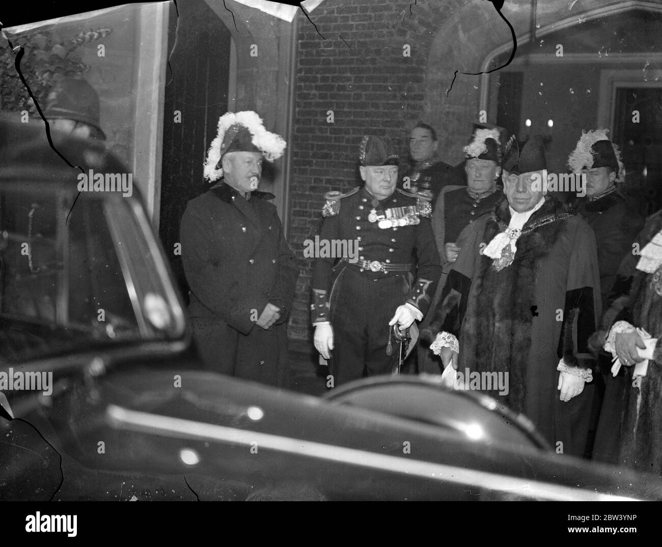 Sir Herbert Samuel and Mr Winston Churchill at St James's Palace - new King takes oath. photo shows: Sir Herbert Samuel (left) and Mr Winston Churchill chatting as they left St James's Palace after King George VI has been sworn in before the Accession Council 12 December 1936 Stock Photo