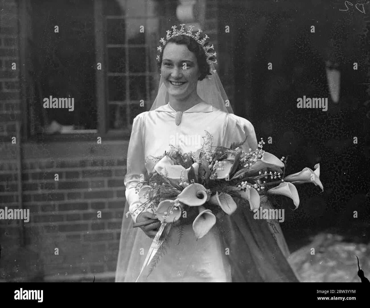 Chief Scout daughter has village wedding . Miss Betty St Claire Baden Powell , youngest daughter of Lord Baden Powell , was married in the old village church of Bently , Hampshire , to Mr Gervas Charles Roberts Clay , district officer in the Administration service of Northern Rhodesia . Mr Clay the elder son of Mr and Mrs Gerard Arden Clay of Albury , Surrey . The bride is 19 years of age . Bridegroom first met his bride last May in the liner in which she was returning to England with her parents and sister . 16 members of the Westminster Abbey choir who belonged to the Boy Scout movement sang Stock Photo