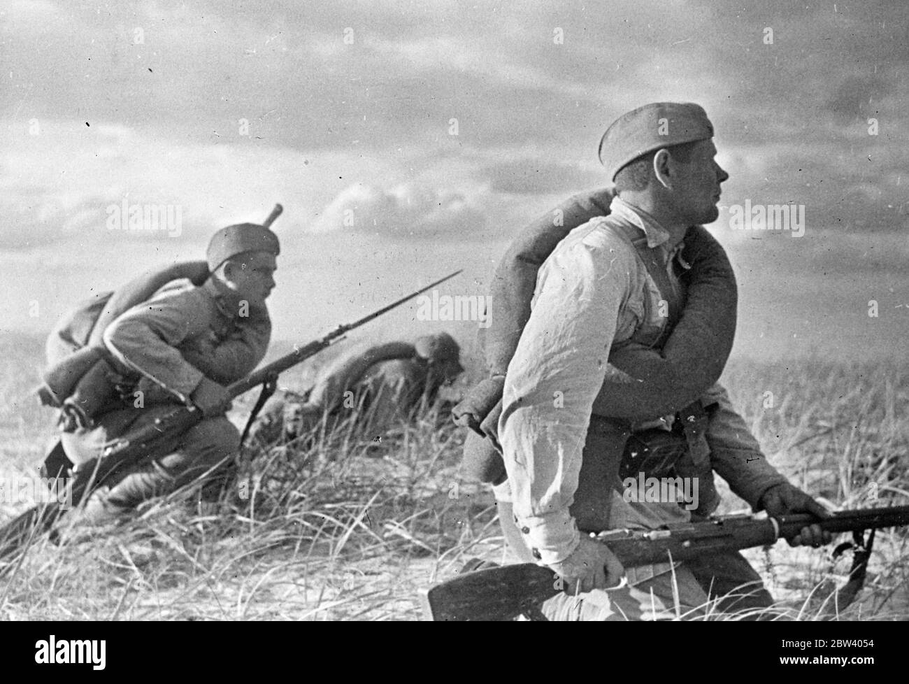 Soviet Army autumn manoeuvres as war chief warns potential enemies. With their leaders thundering counter warnings across the continent of Europe, troops of the Soviet Army are on the march in the Ukraine, where they are carrying out the autumn manoeuvres. Aeroplanes and tanks are cooperating in the exercises. In a speech made at Kiev, Voroshilov, Soviet Commissar for Defence, where has been attending the manoeuvres, issued a warning in which he declared: if anybody attempts to attack our country we will take up arms. We are ready for war, comrades. photo shows: bayonets fixed, men of the Red Stock Photo