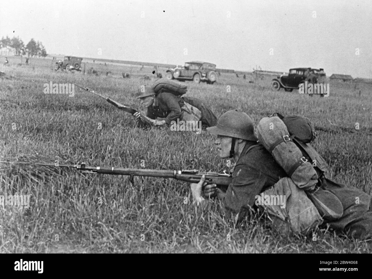 Soviet Army autumn manoeuvres as war chief warns potential enemies. With their leaders thundering counter warnings across the continent of Europe, troops of the Soviet Army are on the march in the Ukraine, where they are carrying out the autumn manoeuvres. Aeroplanes and tanks are cooperating in the exercises. In a speech made at Kiev, Voroshilov, Soviet Commissar for Defence, where has been attending the manoeuvres, issued a warning in which he declared: if anybody attempts to attack our country we will take up arms. We are ready for war, comrades. Photo shows: bayonets fixed, men of the Red Stock Photo