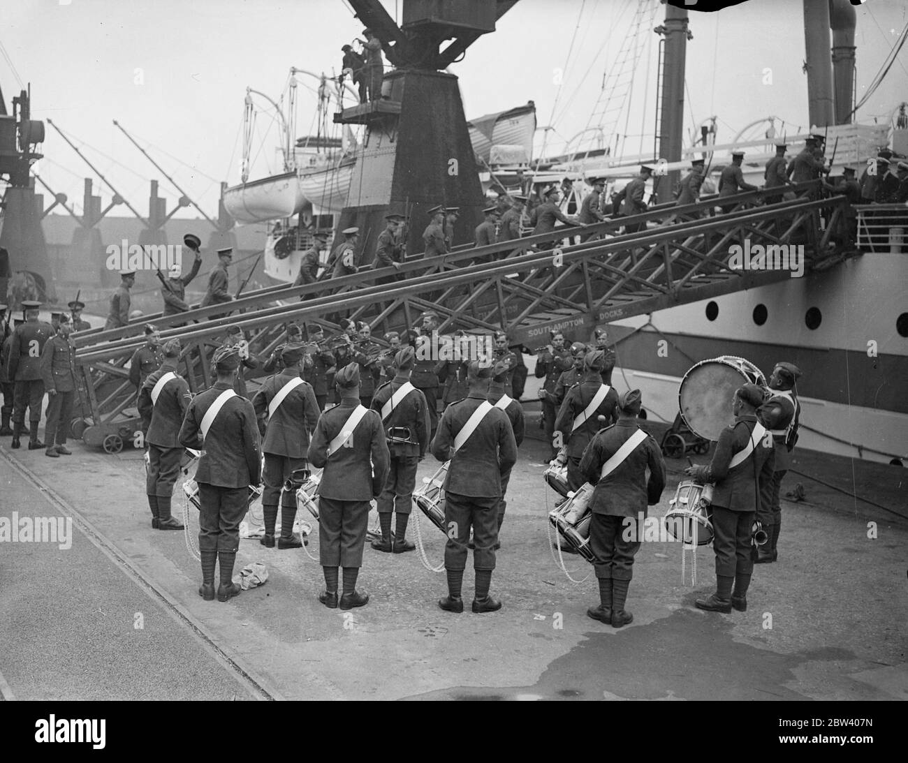 Thousand troops , including reservists , leave for Palestine . Brought to Southampton in four special trains over thousand officers and men of the 2nd battle Wiltshire Regiment , and the 2nd battlelion Kings Royal Rifles embarked troopship Neuralia for Palestine . Nearly 600 reservists were included in the detachment . Photo shows , the band of the Wiltshire's playing the King's Royal Rifles detachment aboard Neuralie at Southampton . 18 September 1936 Stock Photo