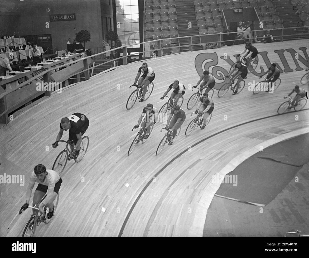 Sprinting at the six days cycle race . Sprints enlivened the first day of the International six days cycle race in which 15 teams representing several countries are competing at Wembley Pool . Photo shows , the sprint in progress at Wembley . 21 September 1936 Stock Photo