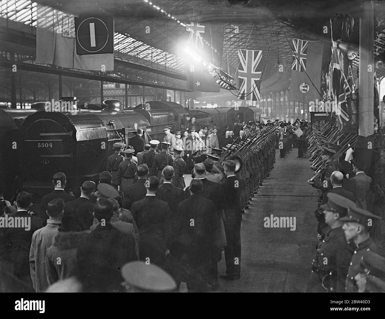 ' Royal Corps ' locomotive named by Cmdr at Euston . Saluted by a guard of honour of the London Corps Signals , Brigadier Hubert Clementi-Smith, Colonel Commandant of the Royal Corps of Signals , named one of the London Midland and Scottish Railway regimental class locomotives ' Royal Signals '' at Euston Station , London . Photo shows , a general view as Brig H Clementi Smith unveiled the plaque on the new locomotive at Euston . 10 April 1937 Stock Photo