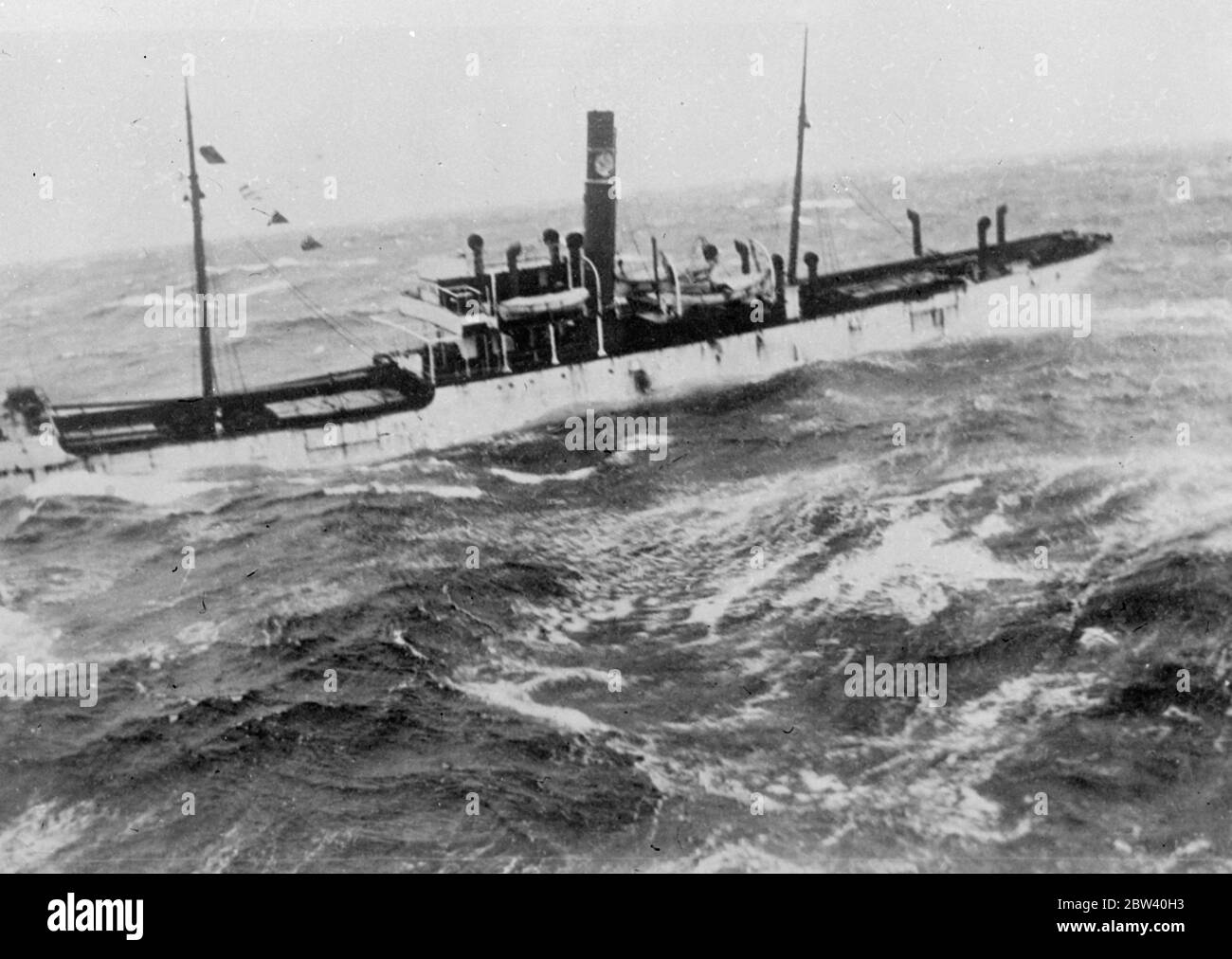 Norwegian ship sinks in Atlantic storm . The Norwegian cargo steamer Bjorkli foundered in a storm 500 miles off Nantucket Lightship . The crew of the sinking ship were taken of by the United States Coast Guard Cutter Chelan , which raced to the scene from Boston , Massachusetts . Photo shows , the Bjerkli about to settle down and sink in the heavy seas , picture taken from the rescue ship Chelan . 5 April 1937 Stock Photo