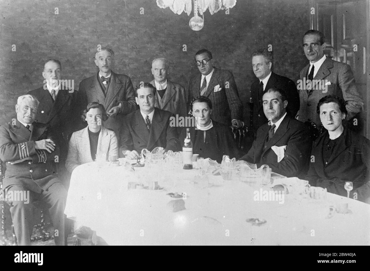 Captain of British foodship and his daughter feted after running Bilbao blockade. Captain W. H. Roberts of Penarth, who ran his British foodship Seven Seas Spray through the insurgent blockade of Bilbao was guest of honour at a special luncheon given in Durango, near Bilbao by Don R. M. Aldasoro, the Councillor of Commerce and Supplies. Also at the luncheon was the skipper's 20-year-old daughter Miss Fifi Roberts. She described the blockade as all my eye and Betty Martin [phrase meaning nonsense]. It is as easy as rolling off a log. Photo shows: to right (seated) - captain W. H. Roberts, Miss Stock Photo
