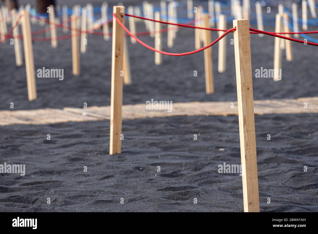 Beach sectioned into areas to seperate people by two metres, social distancing rules, Phase two de-escalation of the Covid 19, coronavirus state of em Stock Photo