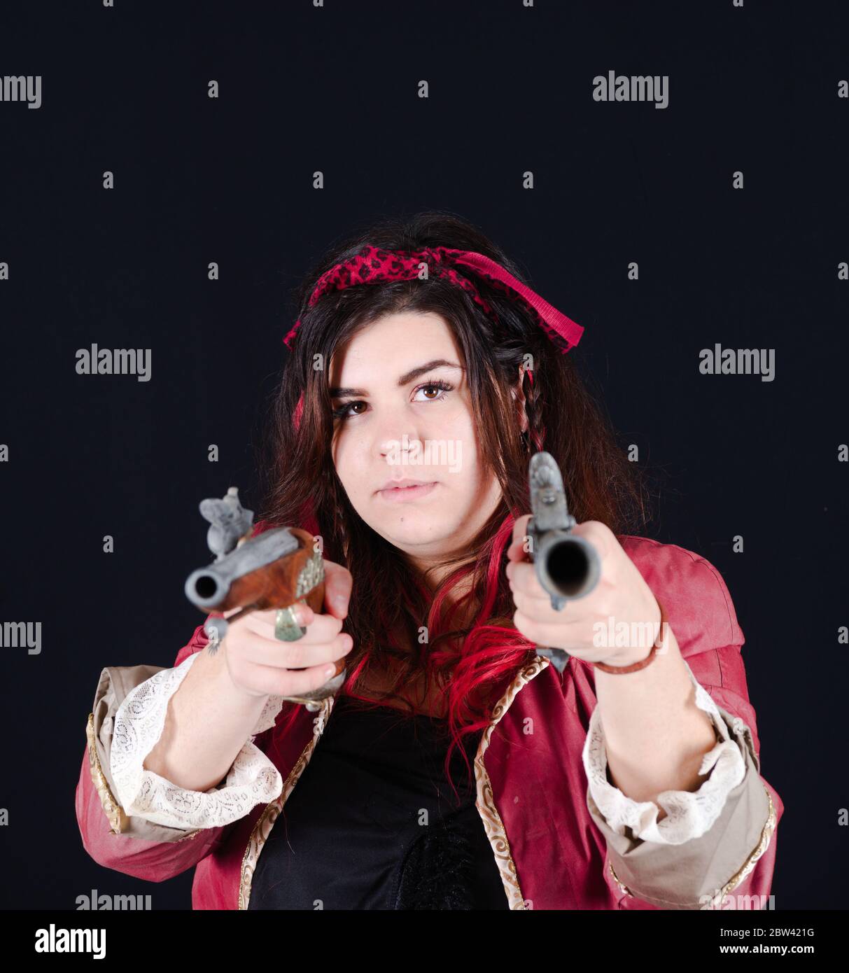 pirate girl with red jacket on the black background Stock Photo - Alamy