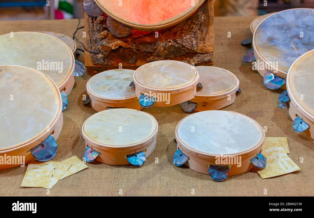 Typical small handmade Salento tambourines for sale on a stall during a