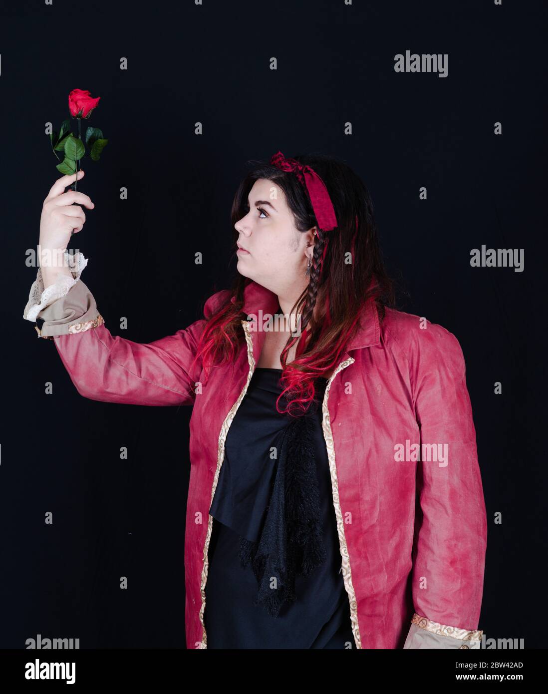 pirate girl with red jacket on the black background Stock Photo - Alamy