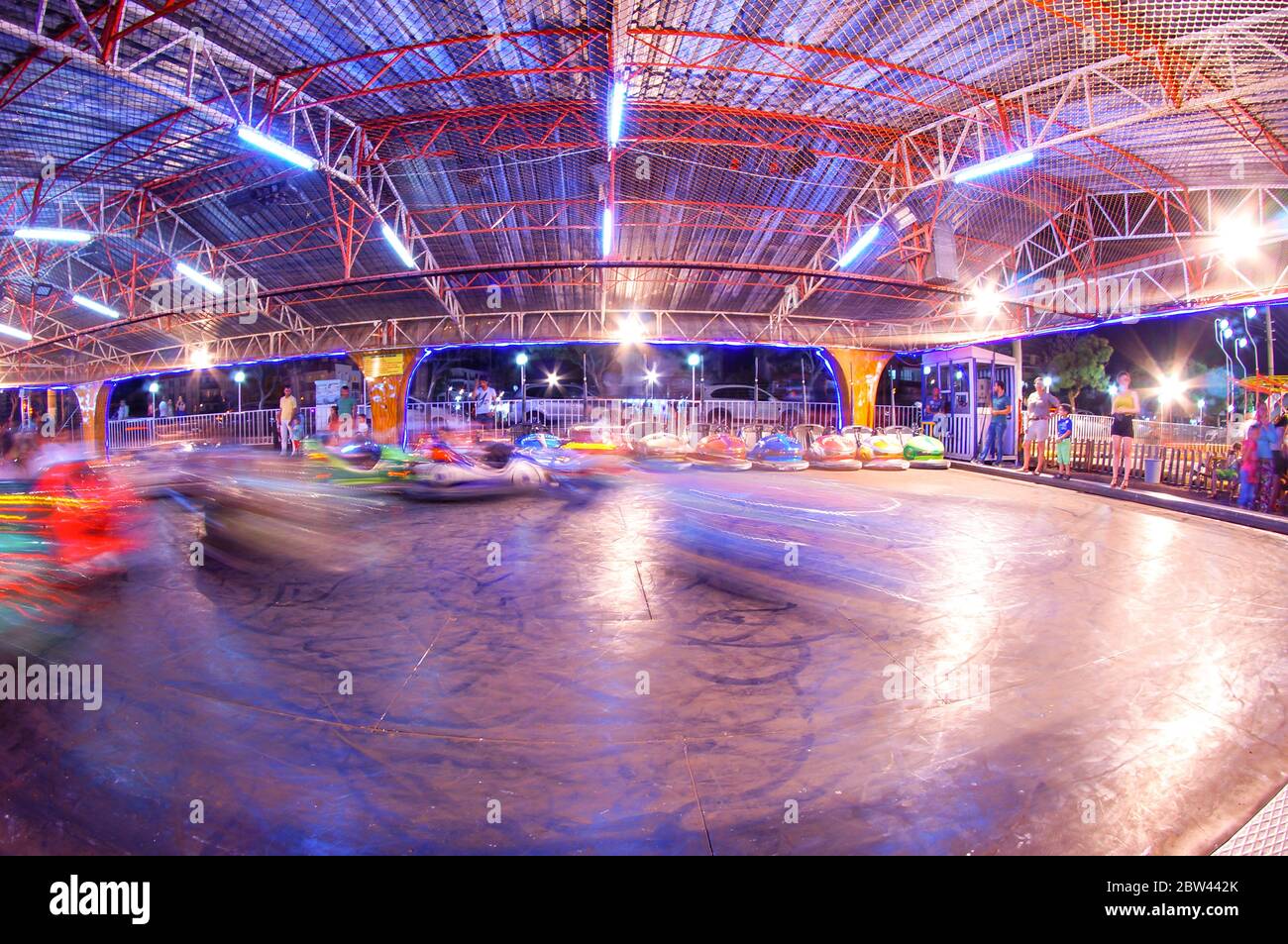 bumper cars in amusement park. long exposure bumper cars. night shot in amusement park. Stock Photo