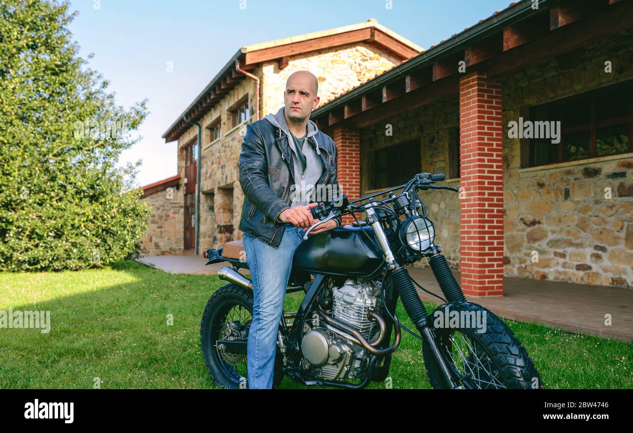 Man riding custom motorbike Stock Photo