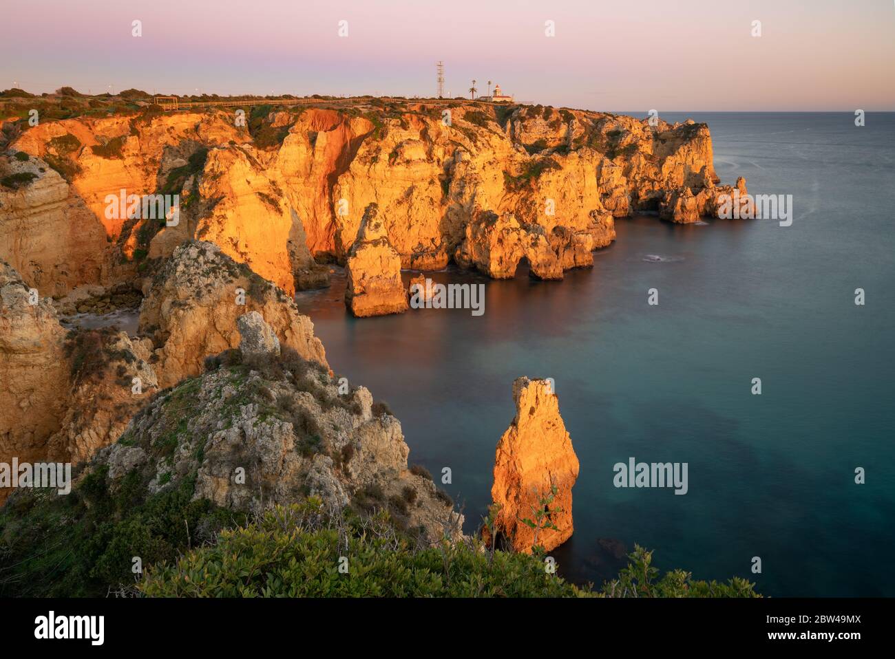 Ponta Da Piedade Farol Lighthouse In Lagos At Sunset In Portugal Stock 