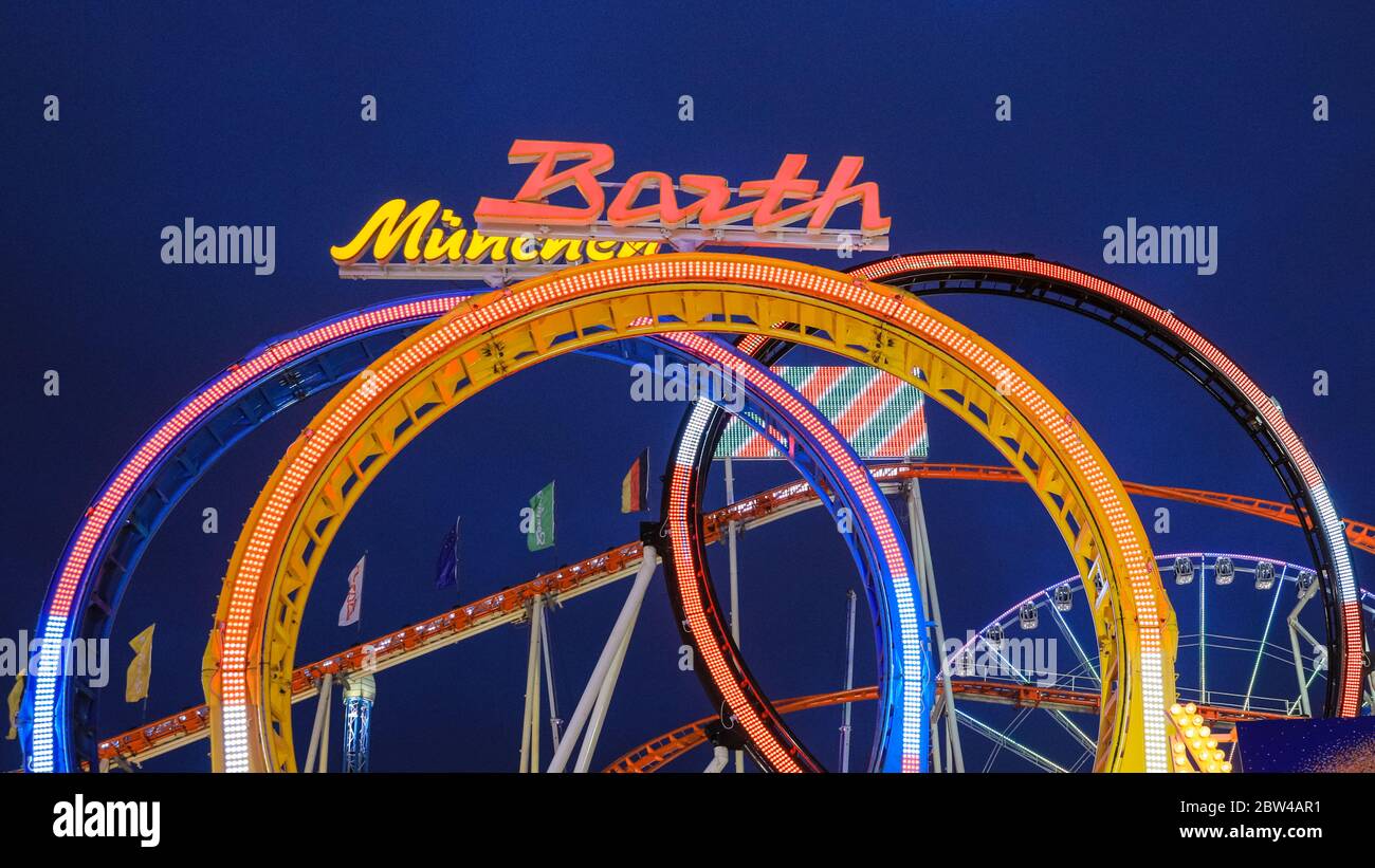 Barth's Olympia Looping, or Munich Looping at night, illuminated, largest portable steel roller coaster in the world at Winter Wonderland, Hyde Park, Stock Photo