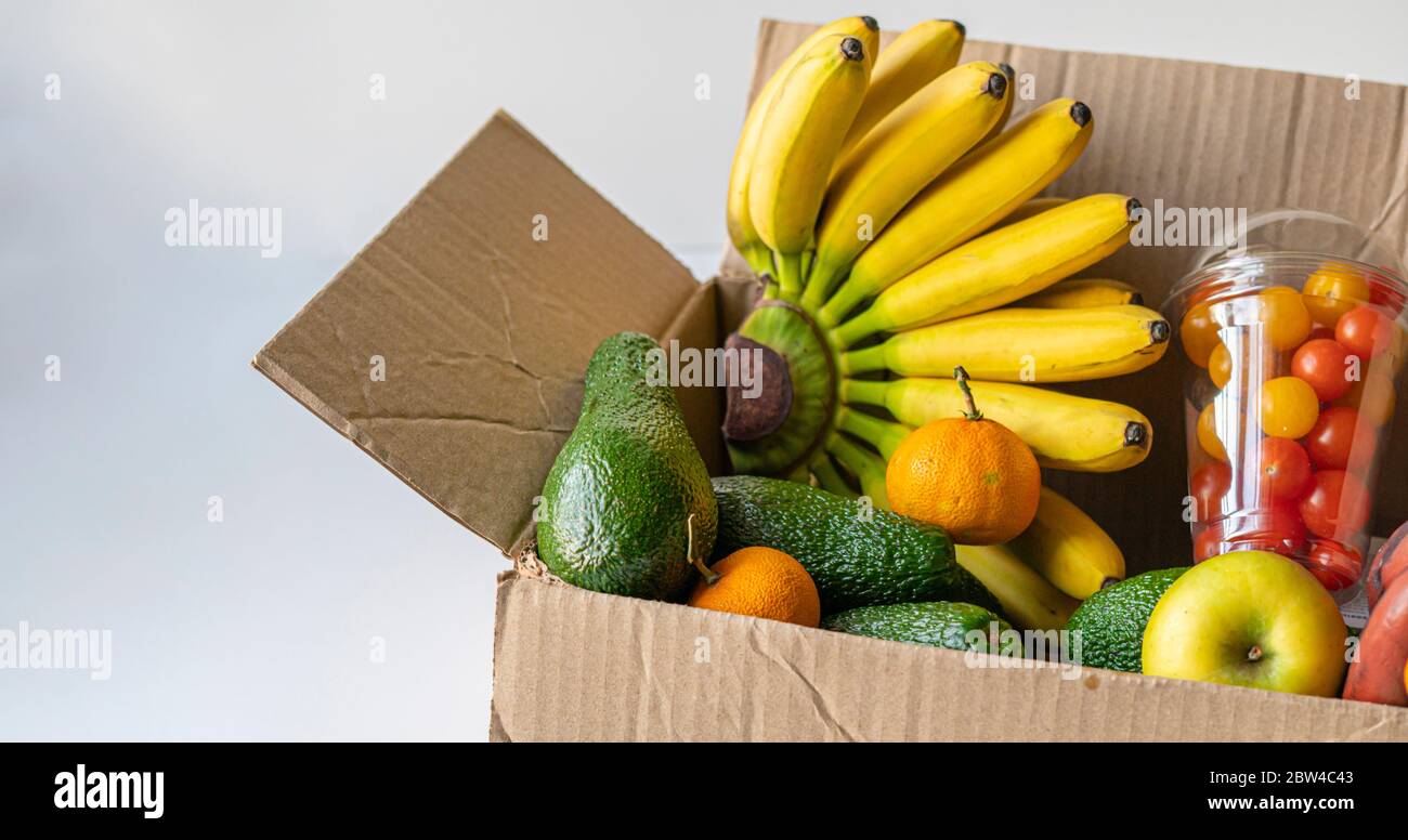 crate with fresh raw fruits to send as the donation to poor children Stock Photo Alamy