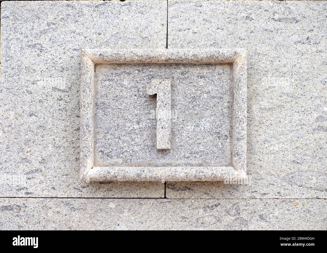 1, number one, numeral digit symbol on stone background. Stock Photo
