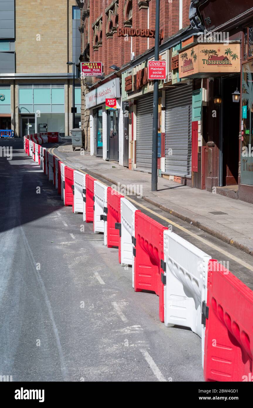 City Centre barriers placed to mark four-metre wide footpaths. Leeds, West Yorkshire, United Kingdom fitted. 100m barriers for social distancing as lockdown eases. Mil Hill Leeds LS1 5DQ Stock Photo