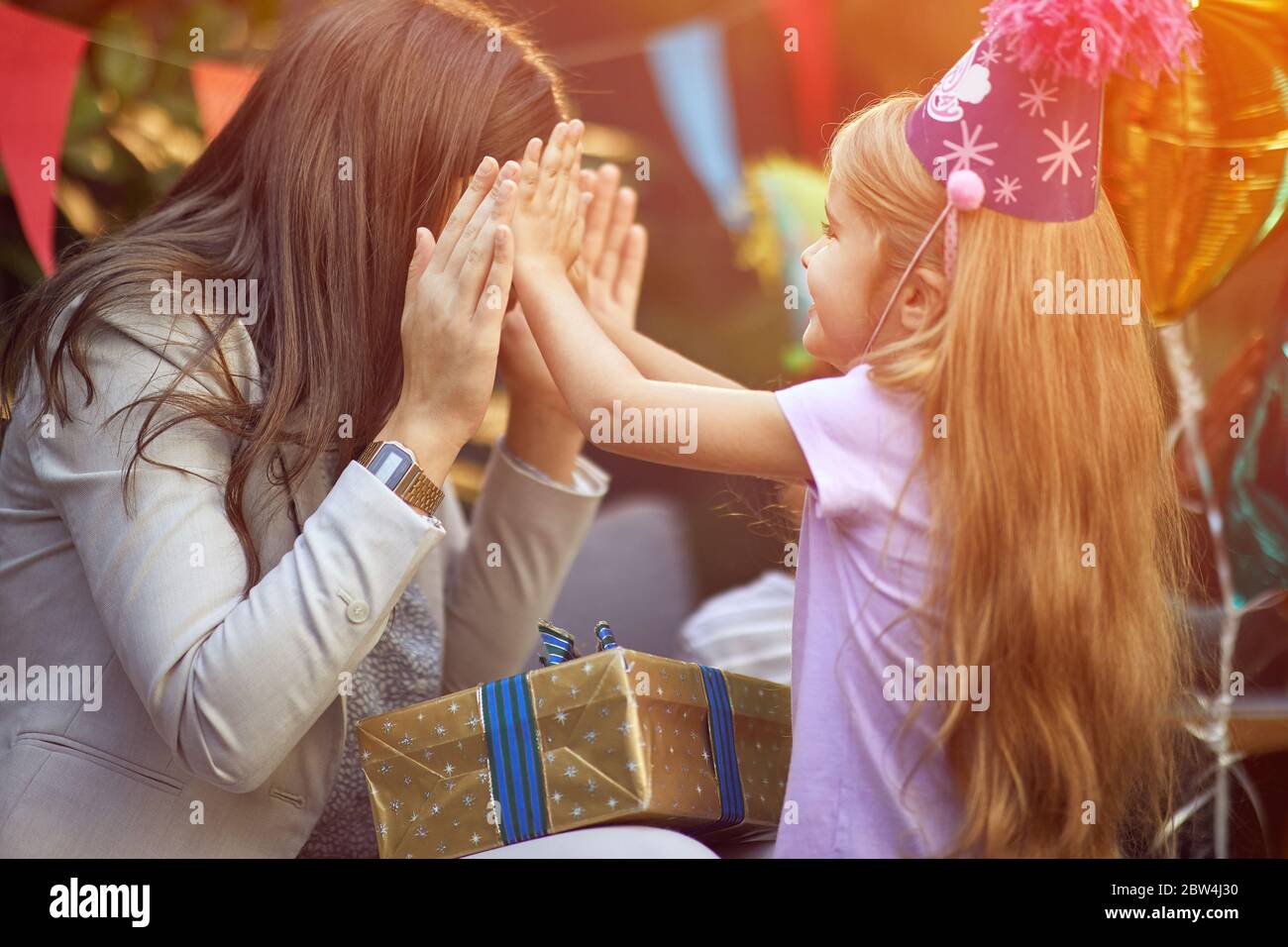 Surprise Birthday party.Happy Mother and her daughter on birthday party