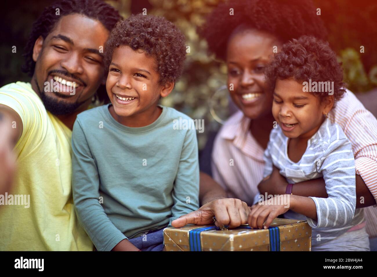 Happy young afro-american people  at birthday party have fun and making selfie. Stock Photo