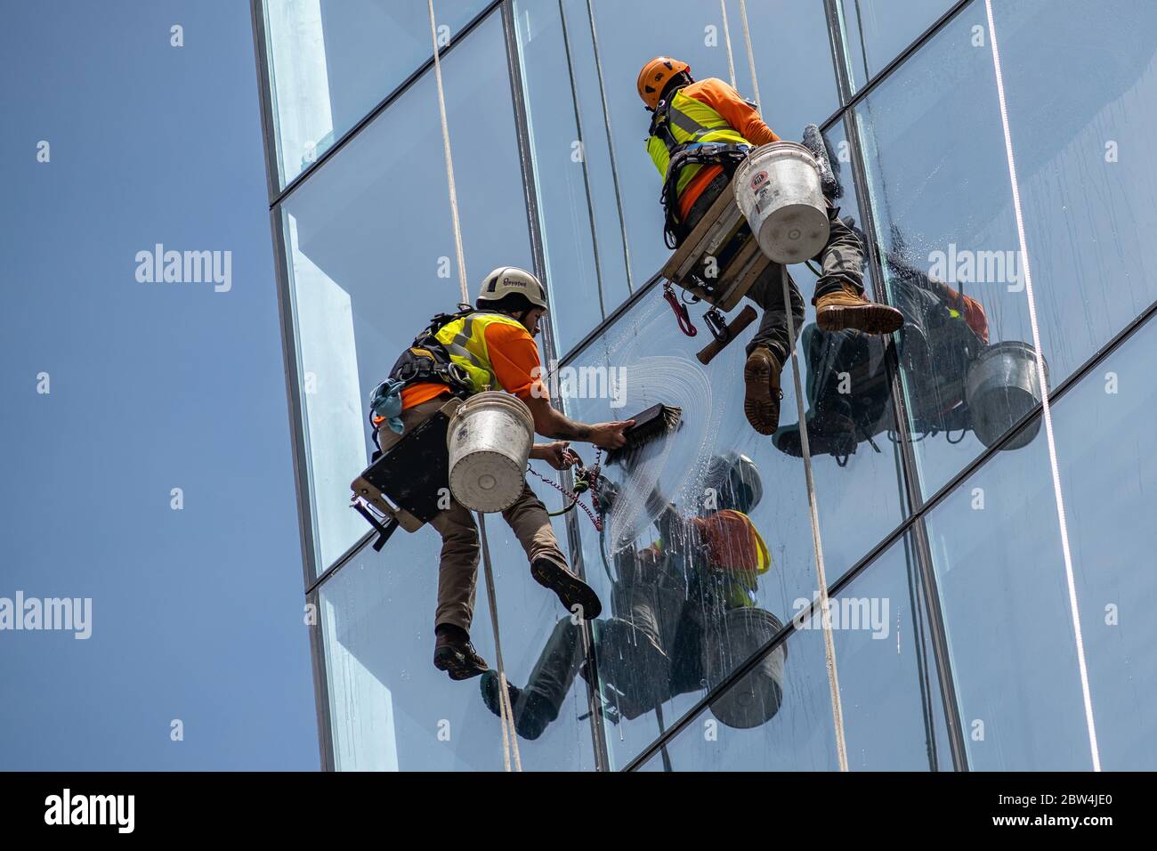 Two window washers at work Stock Photo
