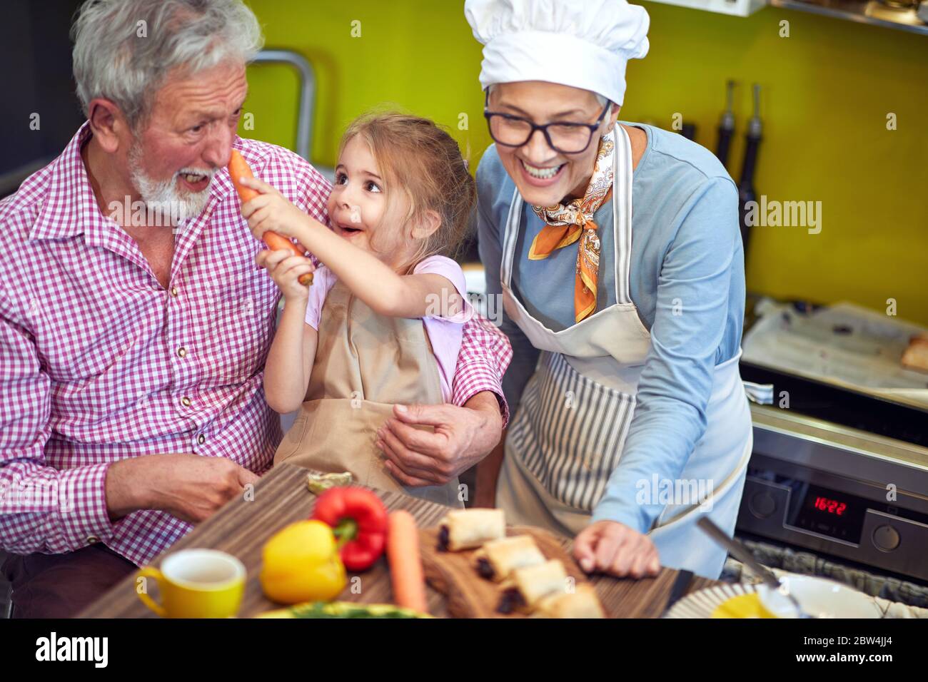 Grandmother grandchildren cooking hi-res stock photography and images ...