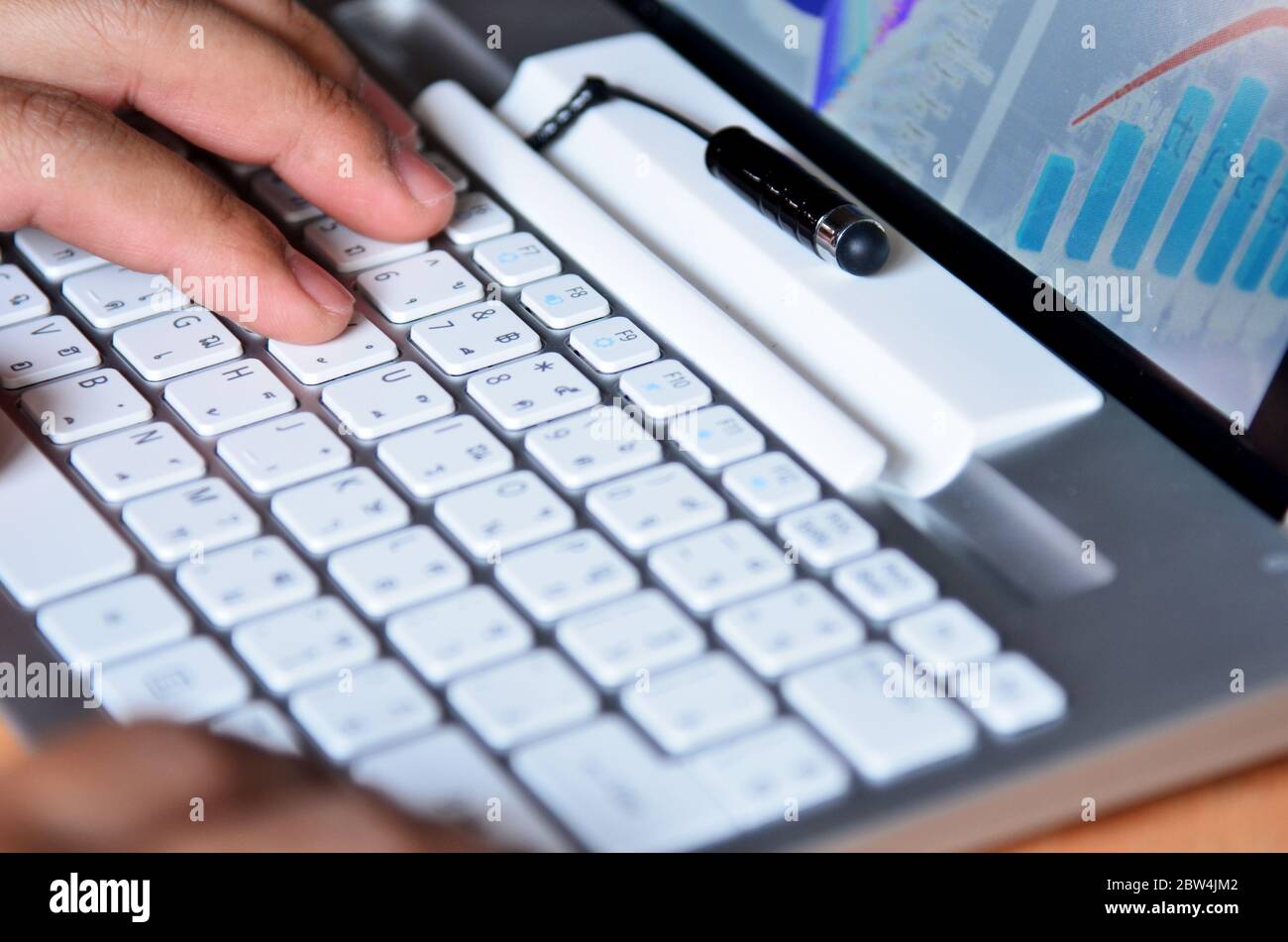 Male hands typing on computer keyboard Stock Photo