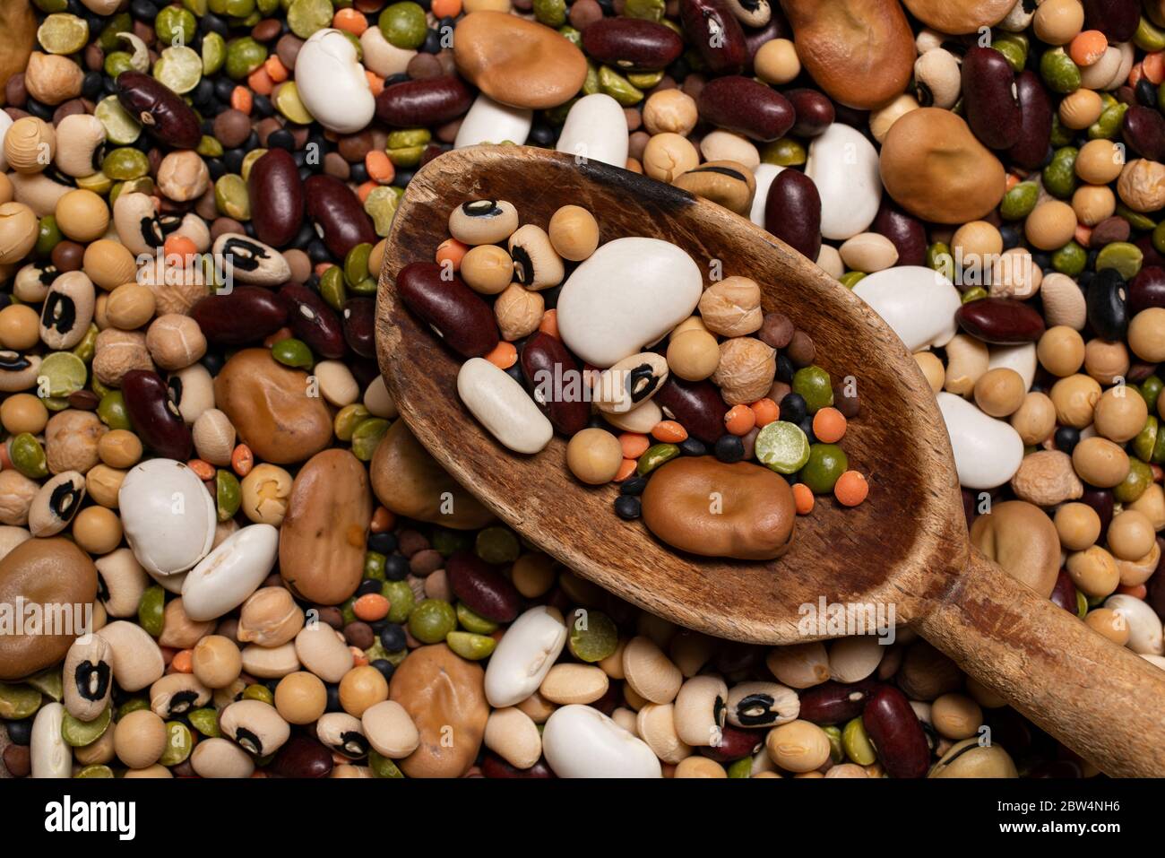 Background with variety of raw and colorful dry legumes rich in protein suitable for a healthy diet Stock Photo