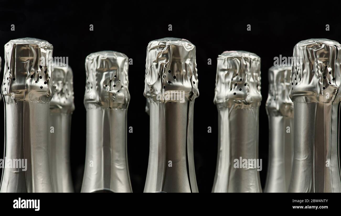 Alcohol party background theme. Champagne bottles heads isolated Stock Photo