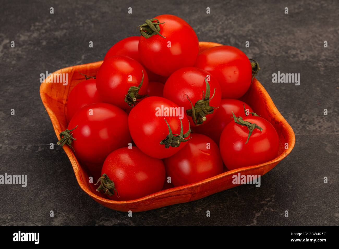 Ripe juicy red cherry tomato in the bowl Stock Photo - Alamy