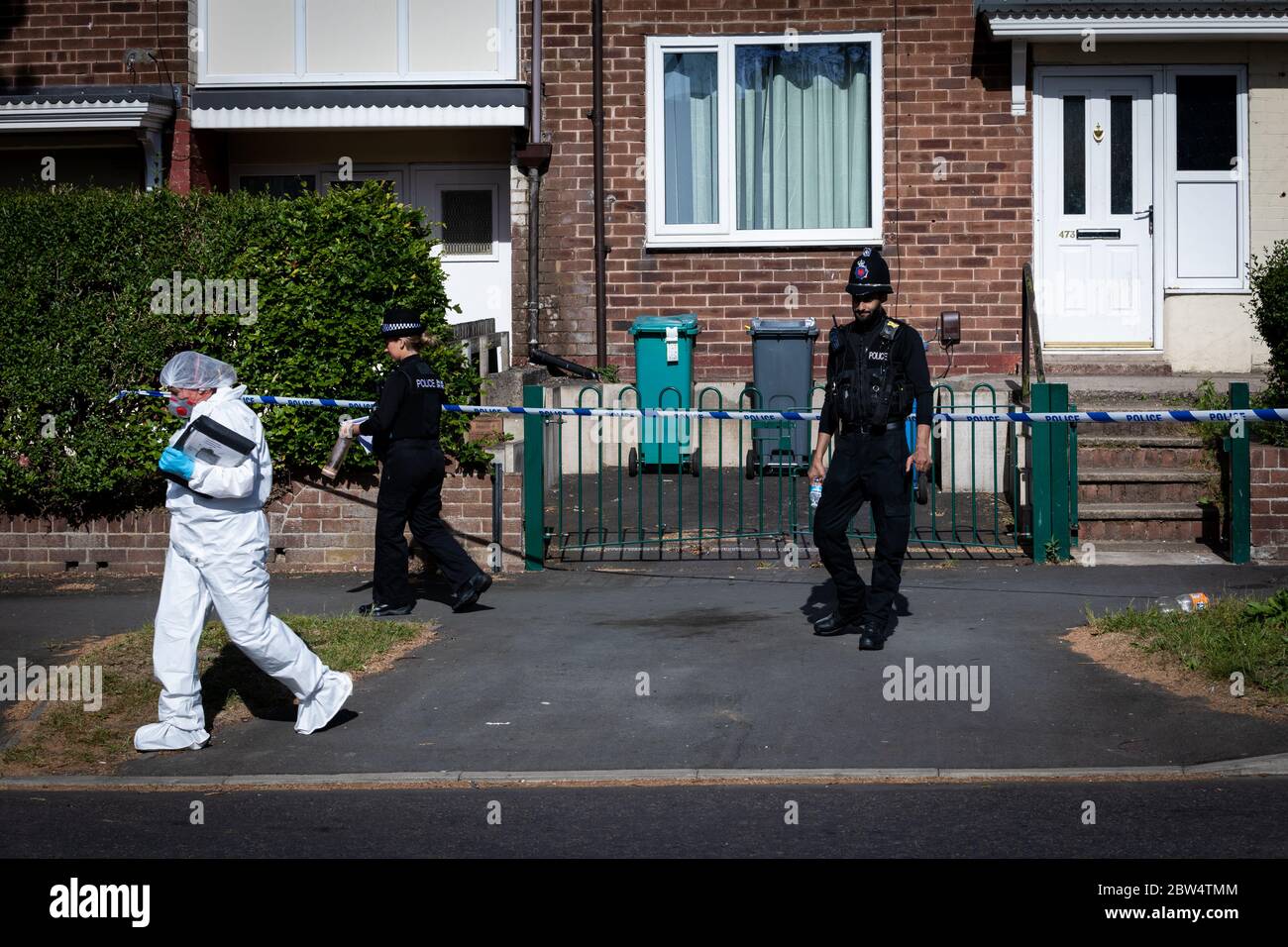 Manchester, UK. 29th May, 2020. A forensic officer leaves the crime scene on Greenwood Road. Credit: Andy Barton/Alamy Live News Stock Photo