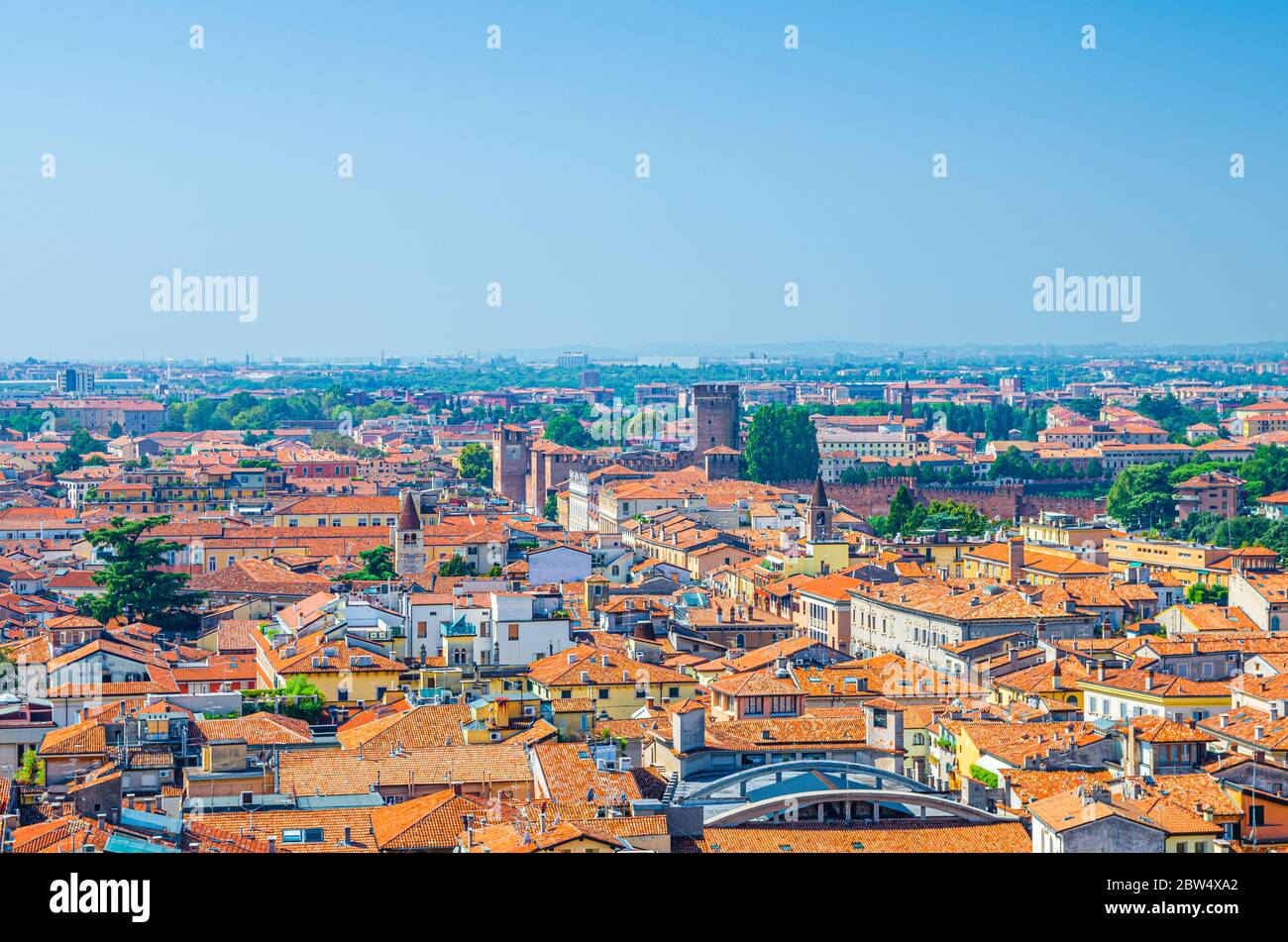 Aerial view of Verona city historical centre Citta Antica with red tiled roof buildings. Panoramic view of cityscape of Verona town. Blue sky background copy space. Veneto Region, Northern Italy Stock Photo