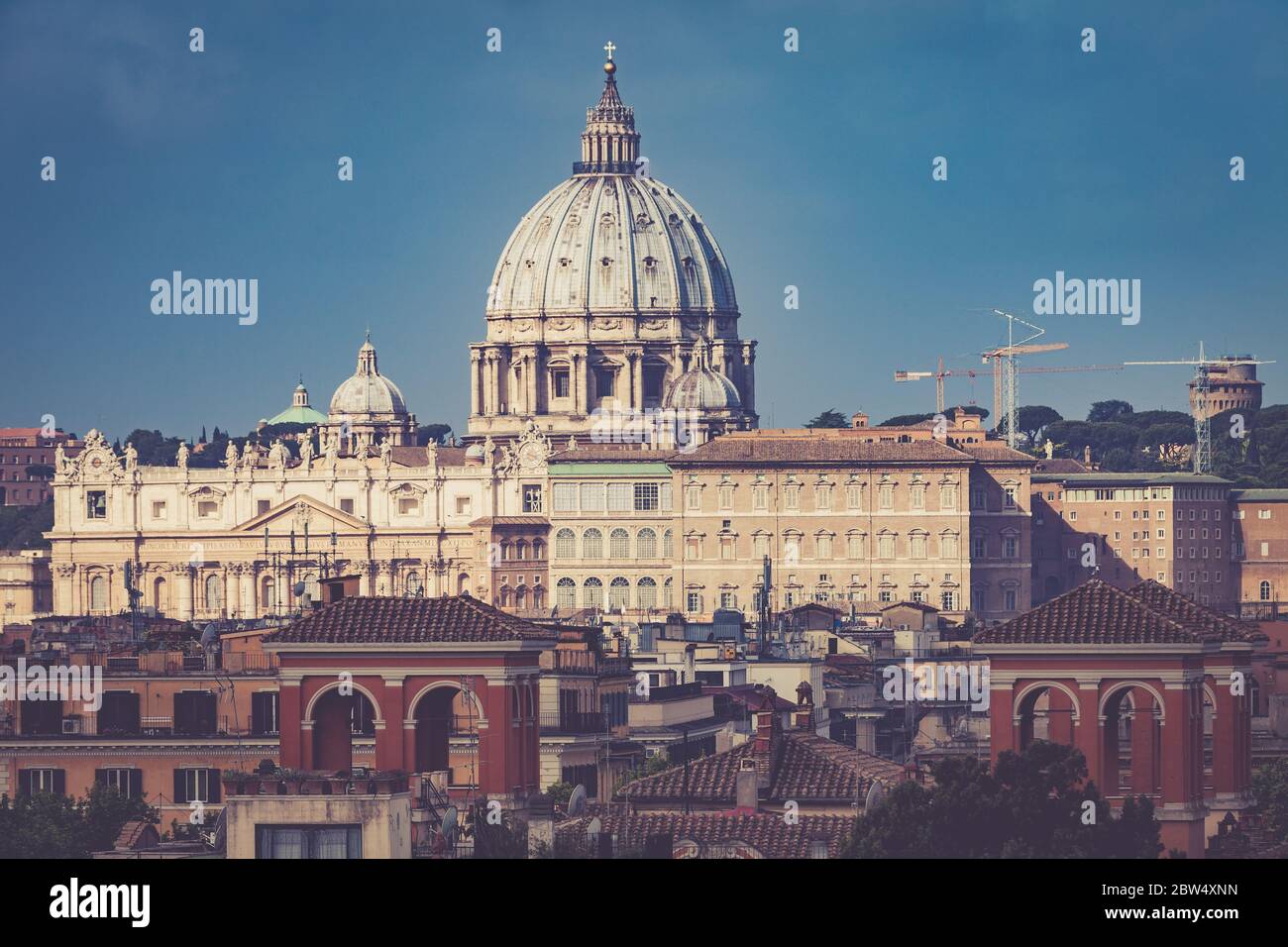 St. Peter Vatican City, Rome, Italy. Aerial view at the morning. The dome of St. Peter view from the side. Lights, sky, no clouds. Suggestive atmosphe Stock Photo