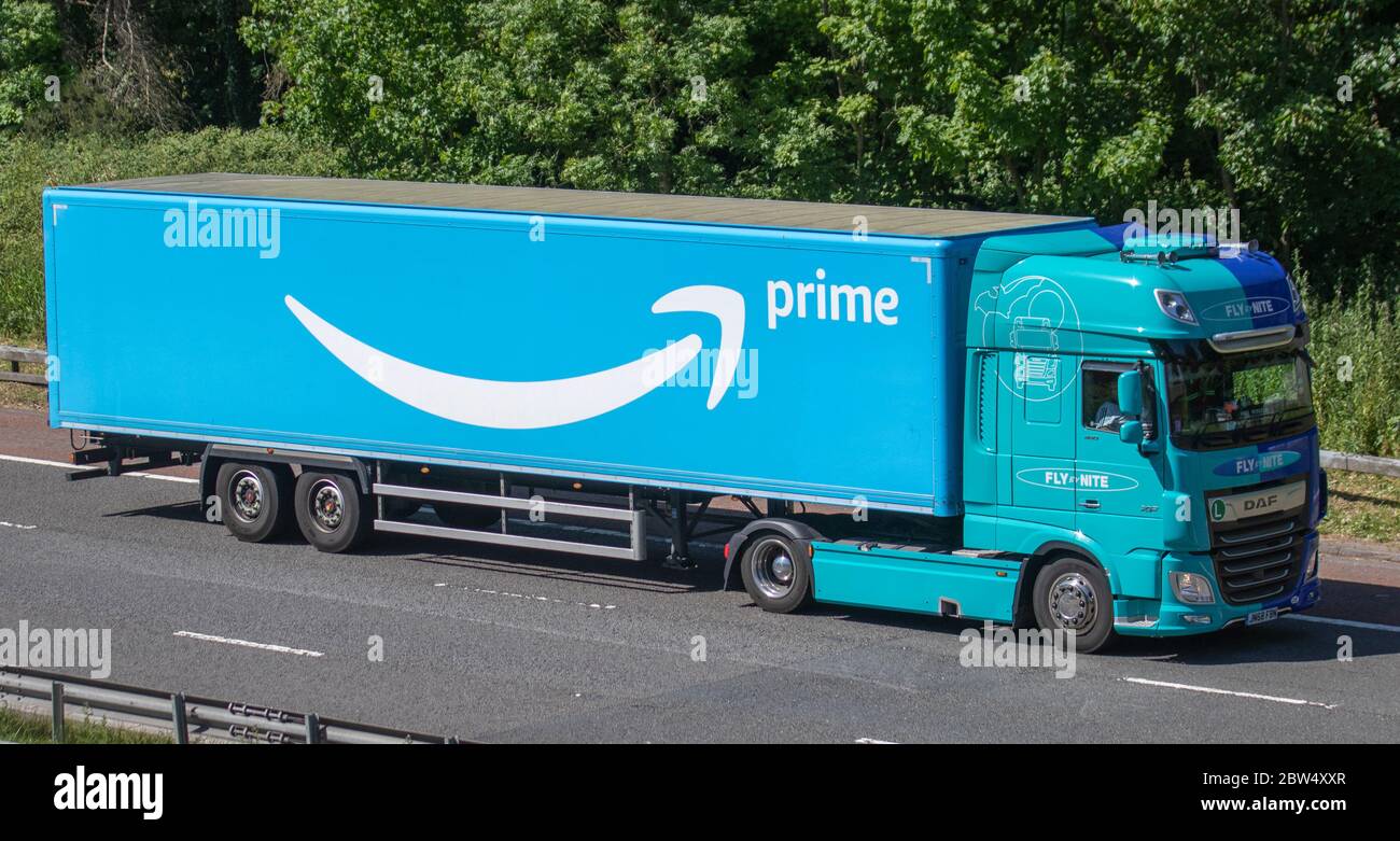 Amazon Prime blue Haulage delivery trucks, lorry, transportation, truck,  cargo carrier, DAF vehicle, European commercial transport industry HGV, M6  at Manchester, UK Stock Photo - Alamy