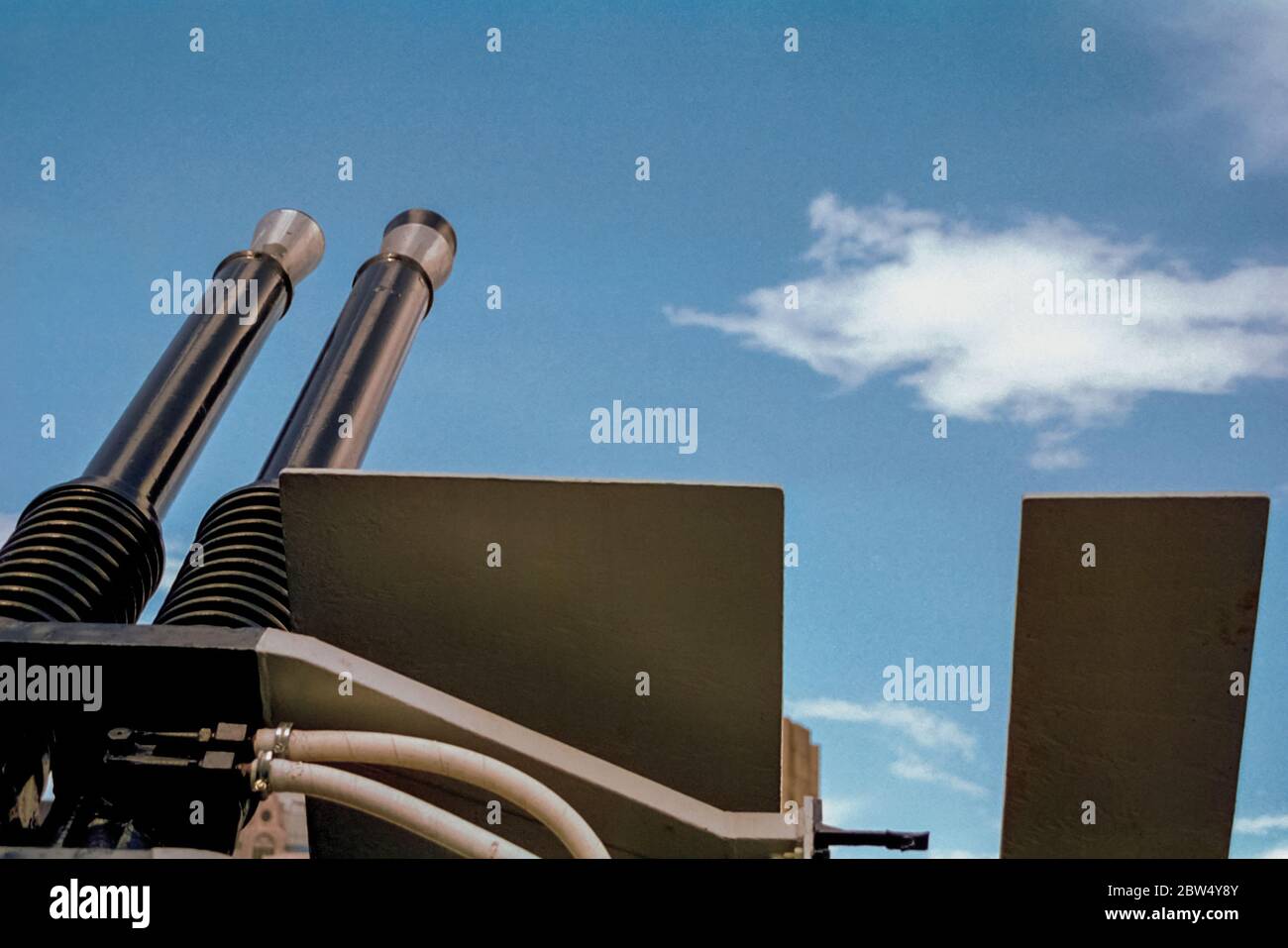 Detail of anti-aircraft gun aiming at the sky on the HMS Belfast warship in London. Capital of England and the United Kingdom. Stock Photo
